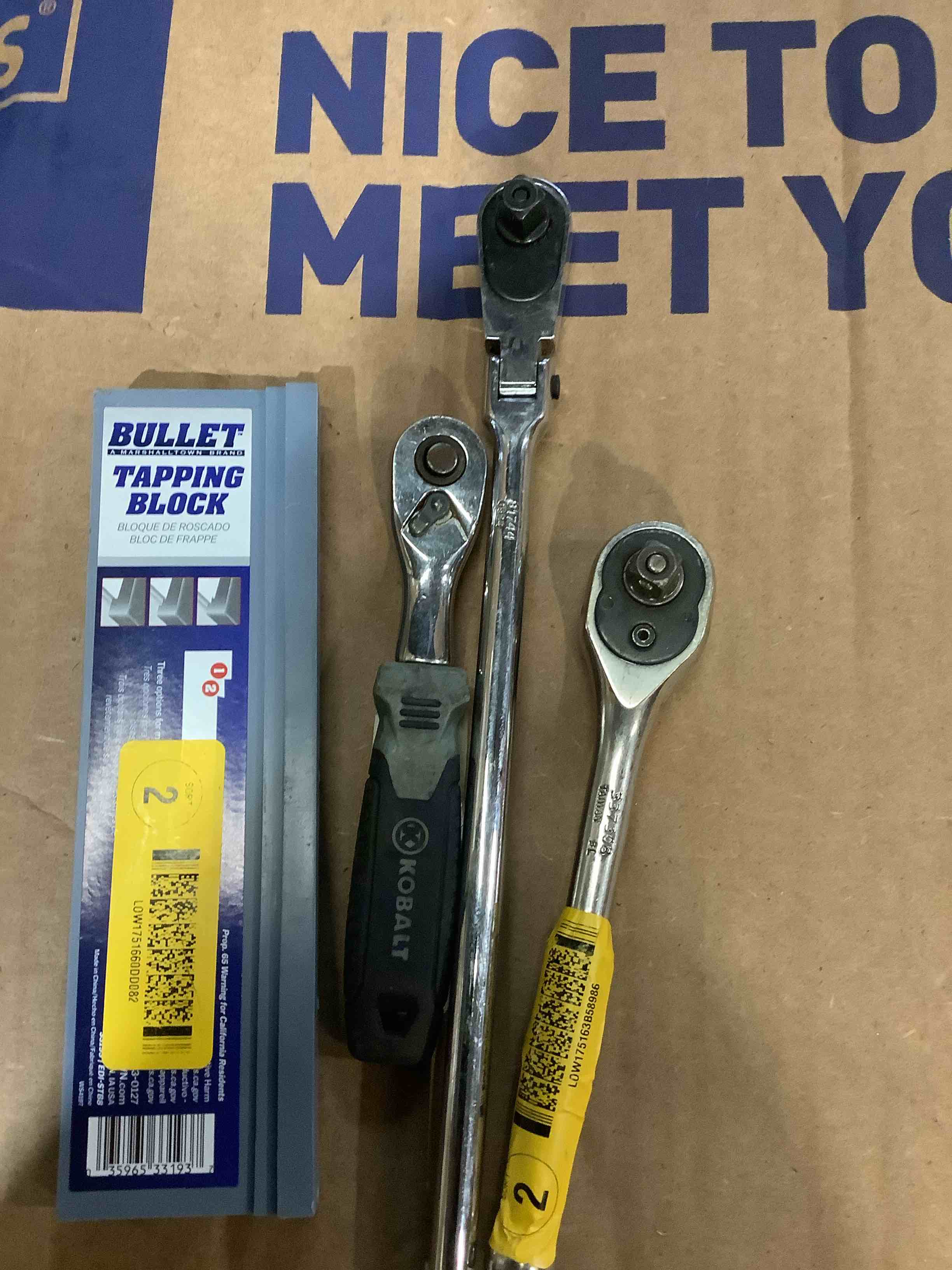 Assortment of tools: bullet, tapping block, cobalt, racket, and more