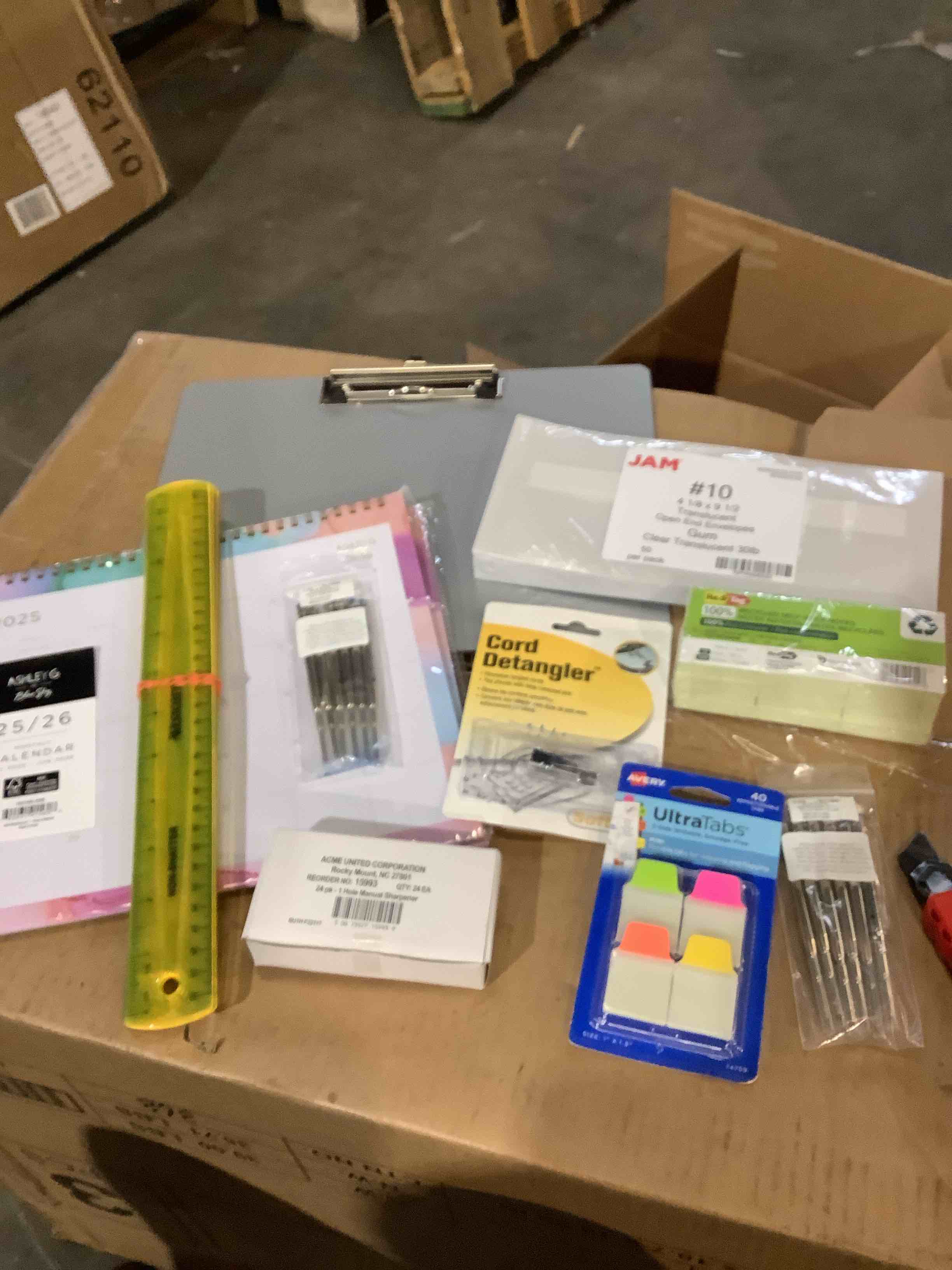 Assortment of office supplies; ultra tabs, 25/26 calendar, Post-it notes, pour detangler and much more