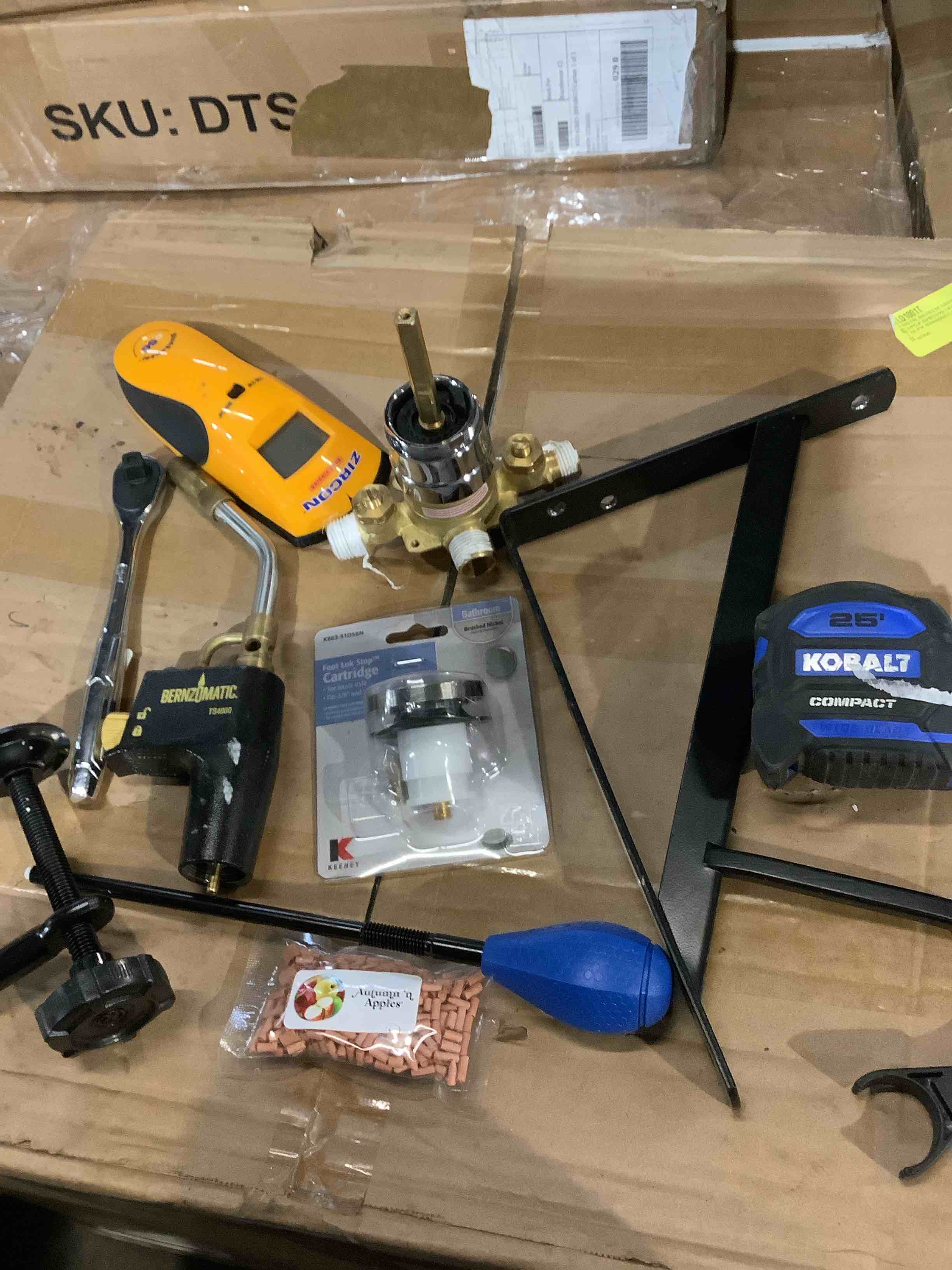 Assorted tools: measuring tape, benzo, Matic, foot, lock, stock, cartridge, valve, wrench,Zircon and more