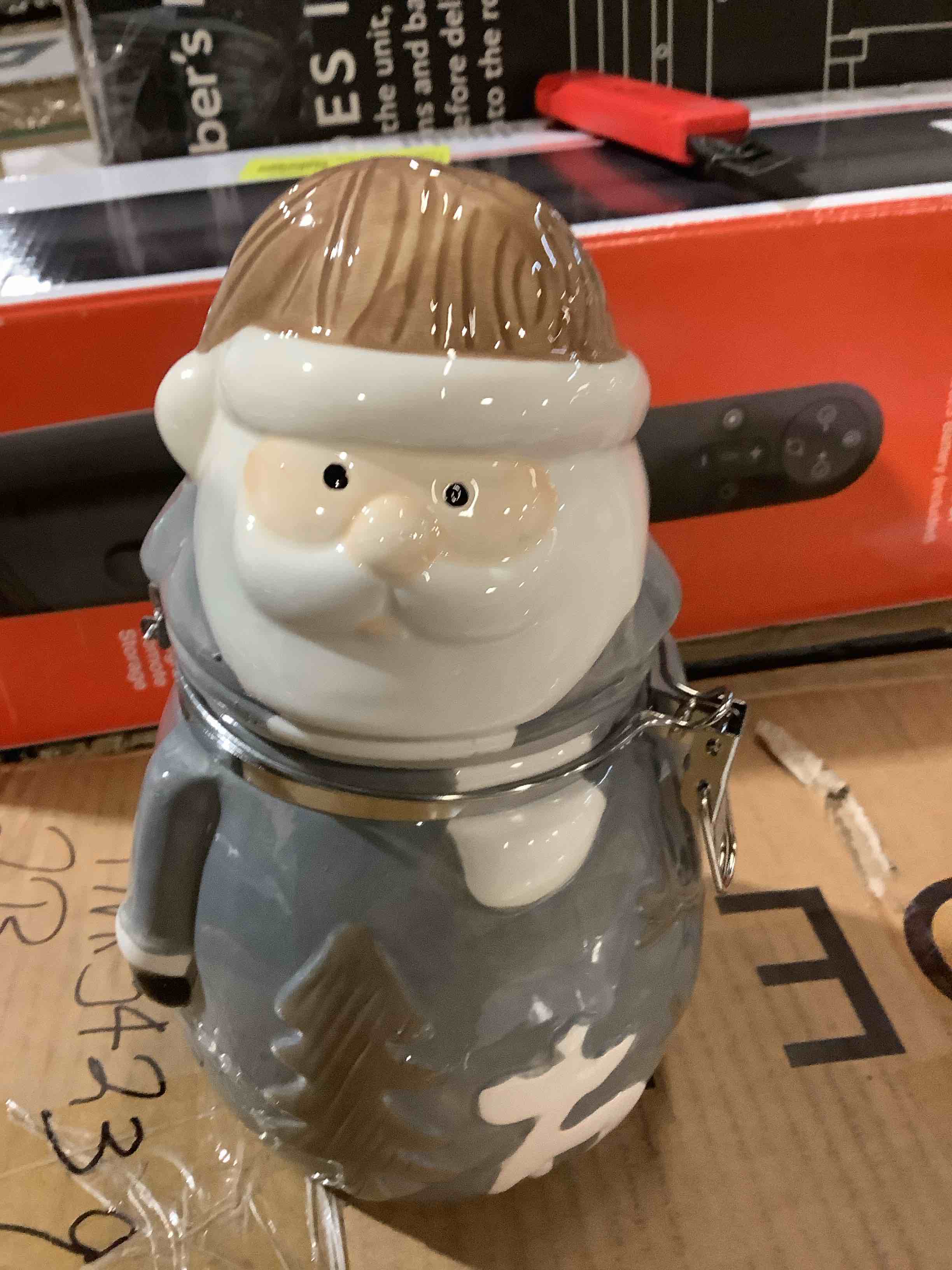 Santa canister 21.8 fluid ounces, in office