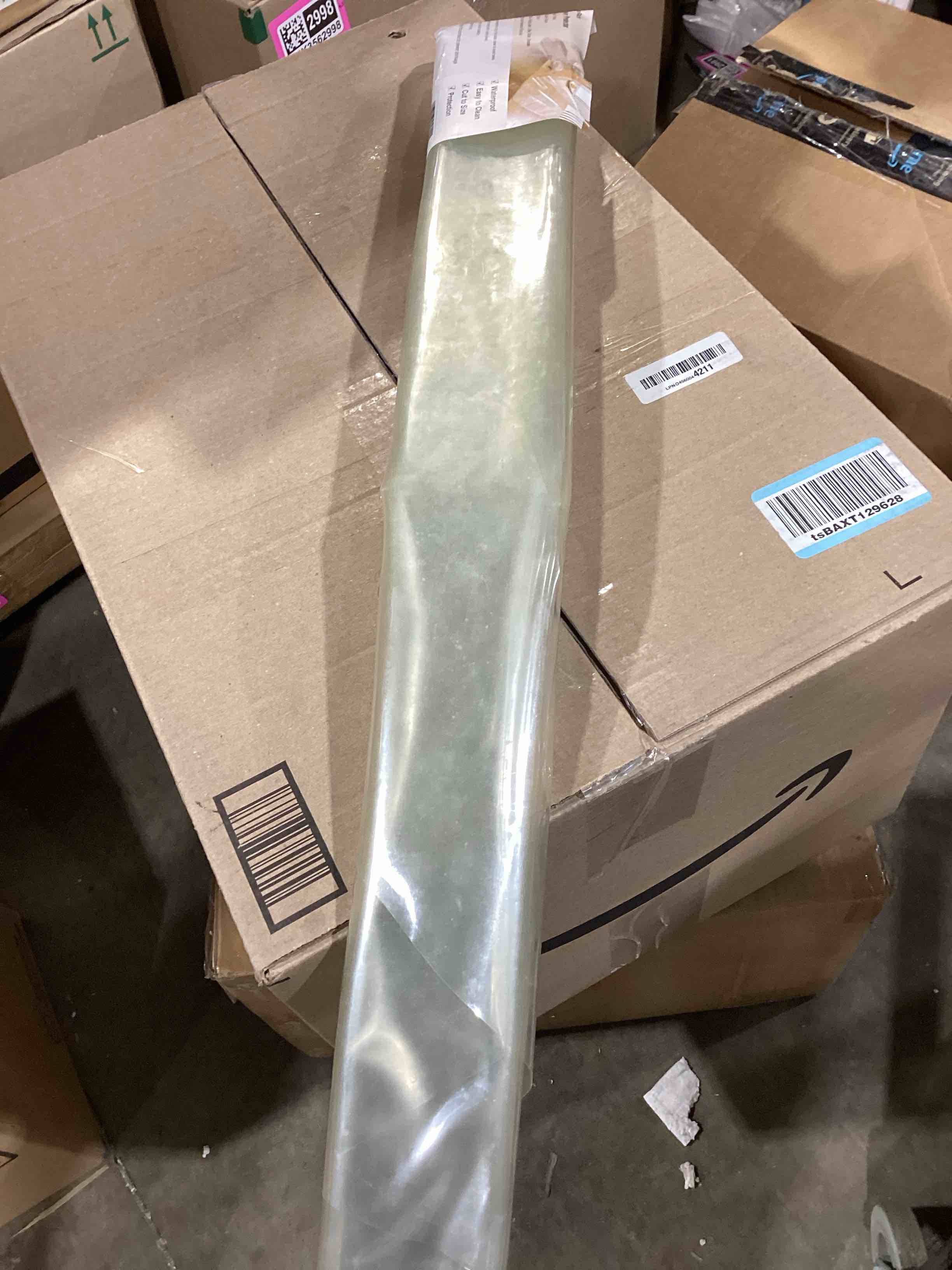 Condition photo showing As Is for lovepads clear table cover protector, 48 x 72 inch 2mm thick plastic table cover, table protector for dining room table, waterproof dresser cover top for kitchen, coffee, writing desk 48" x 72" (rectangular) clear 2mm