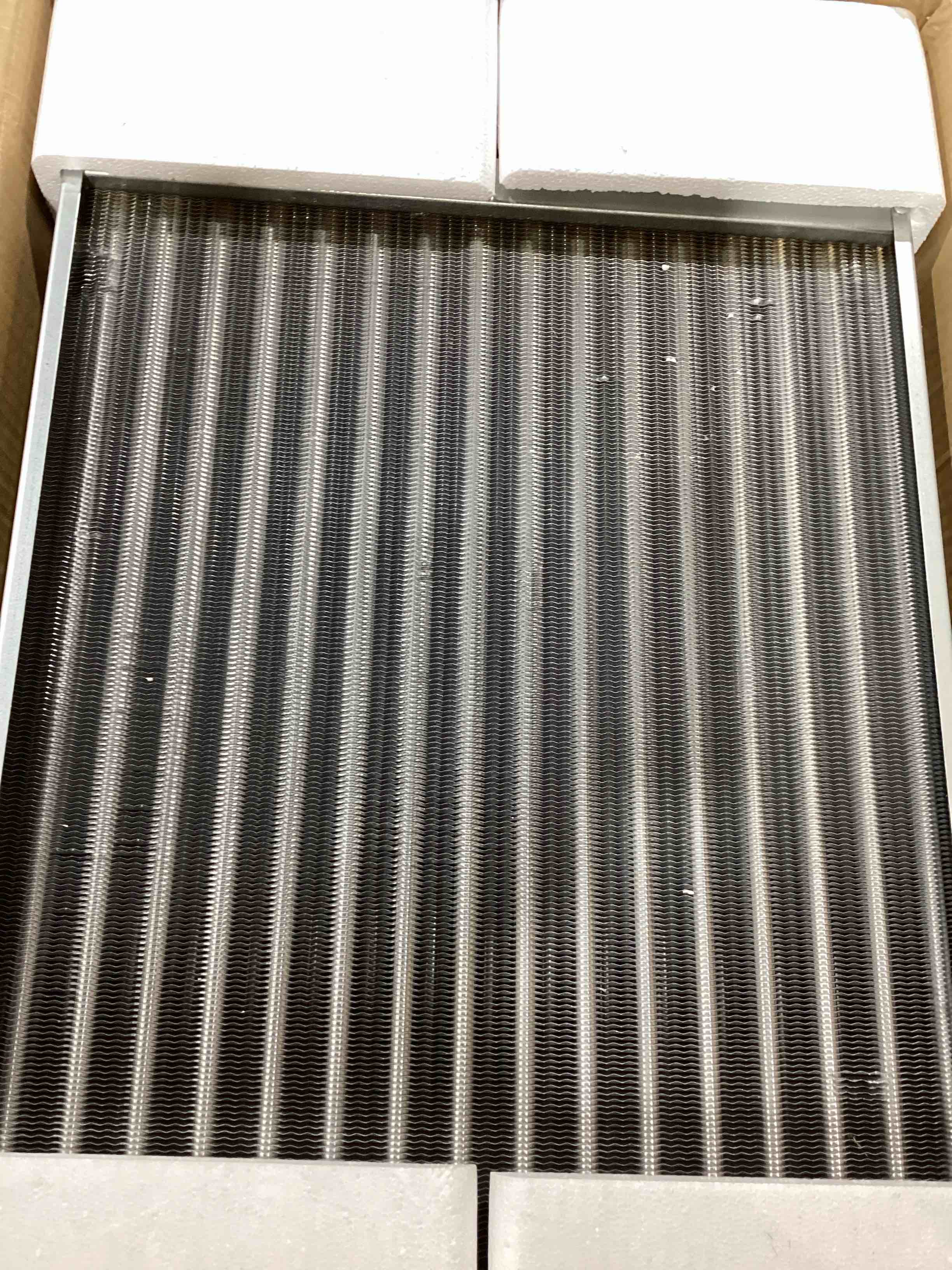 Condition photo showing New/Like New for water to air heat exchanger 16x18 with 1" copper ports for outdoor wood furnaces, residential heating and cooling, and forced air heating (htl16x18)