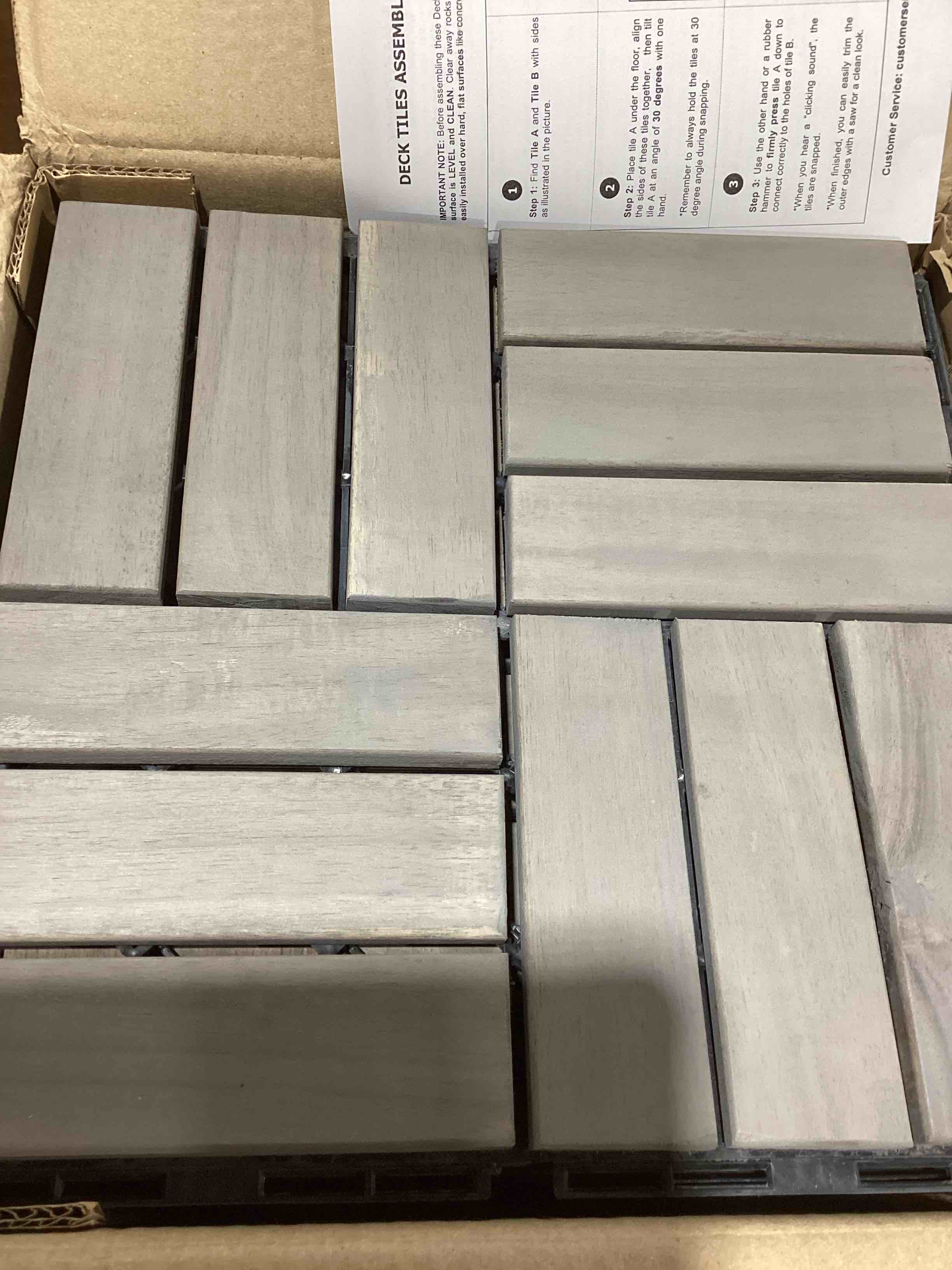 Condition photo showing New/Like New for 12 in. x 12 in. wood interlocking flooring tiles indoor outdoor patio garden
