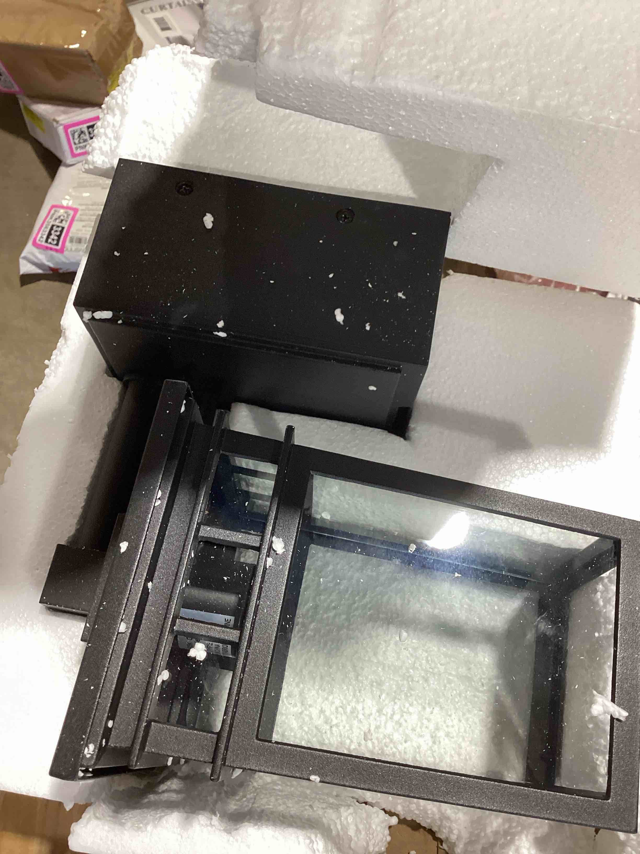 Condition photo showing New/Like New for 9.75 matte black dusk to dawn outdoor wall lantern sconce with bui
