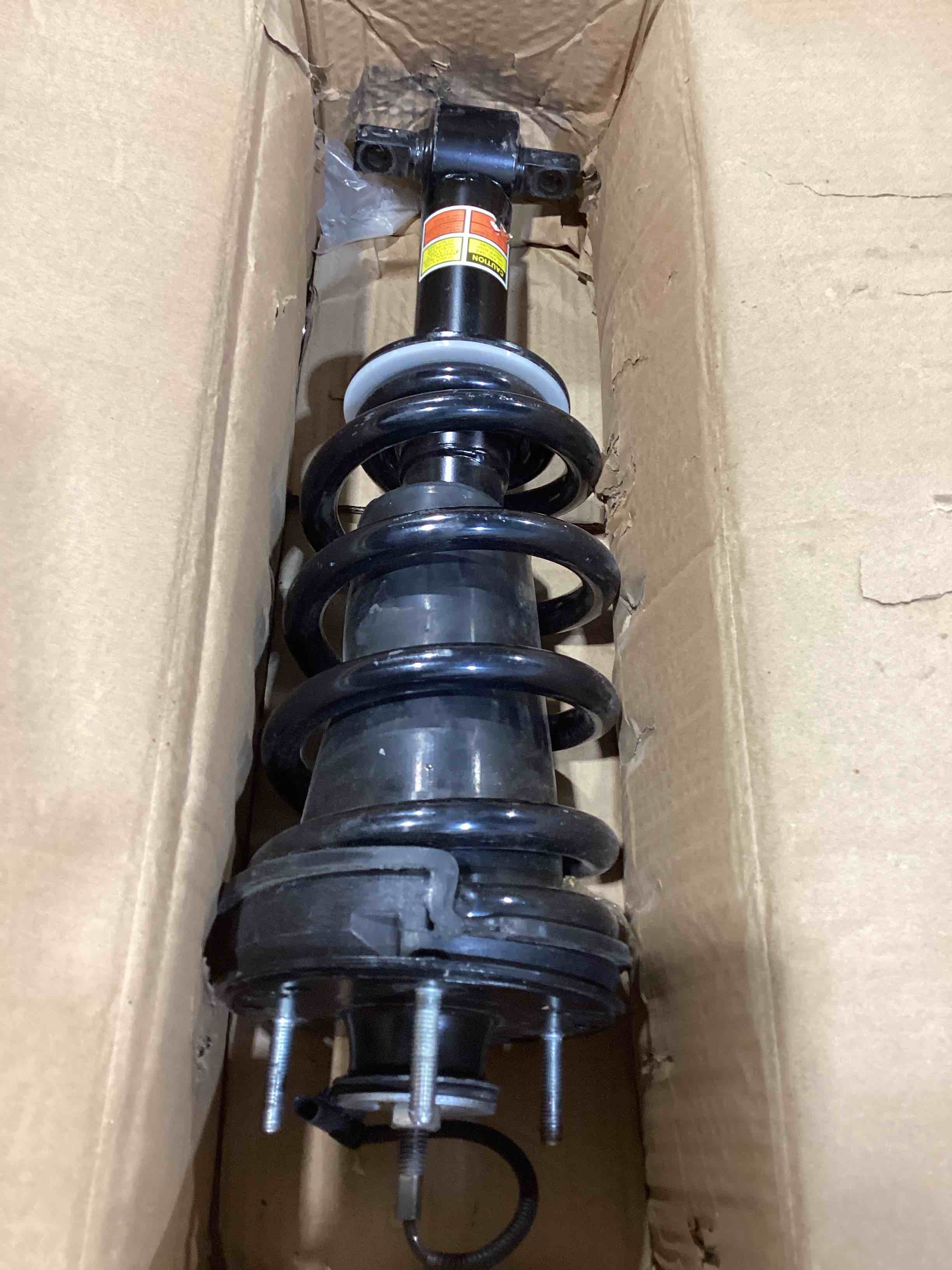 Condition photo showing As Is for 2pcs front shock struts assys for escalade tahoe yukon denali magneride 84176631