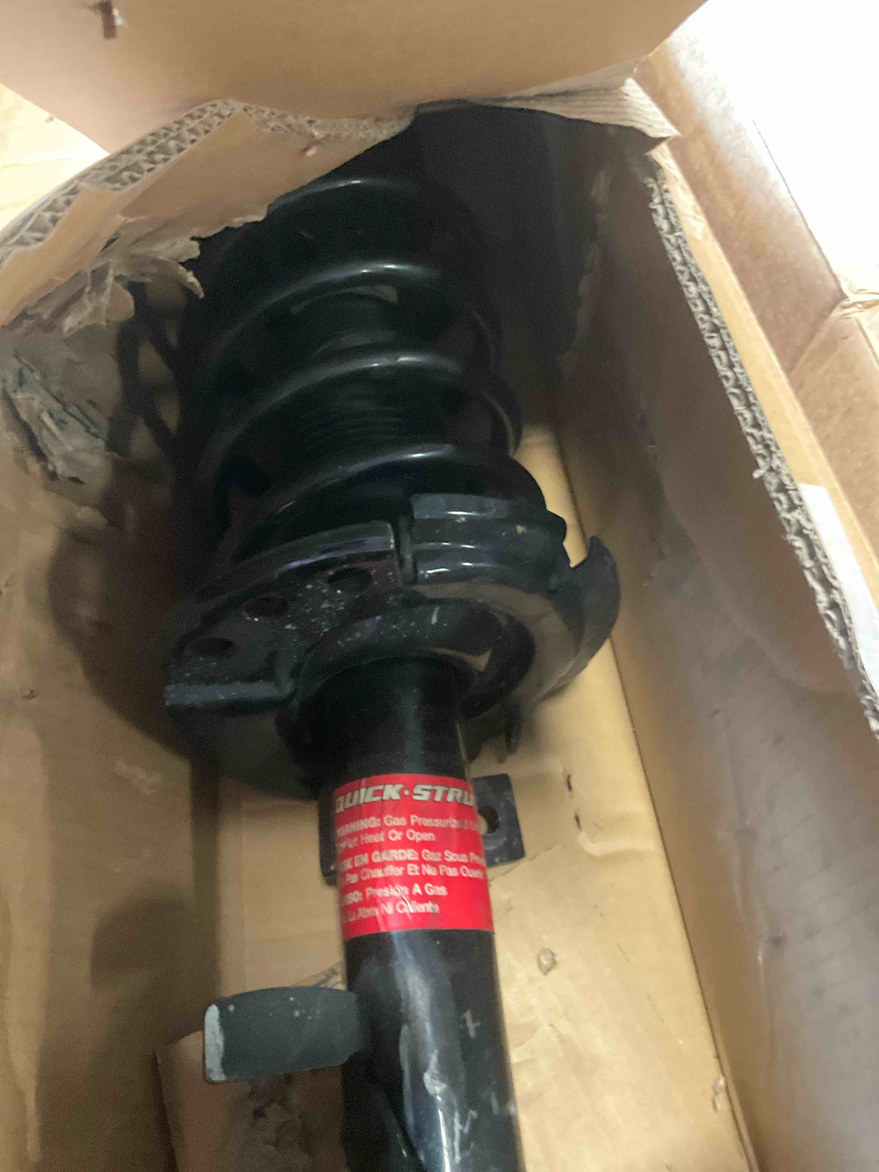 Condition photo showing As Is for Monroe Shocks & Struts Quick-Strut 272788 Strut and Coil Spring Assembly
