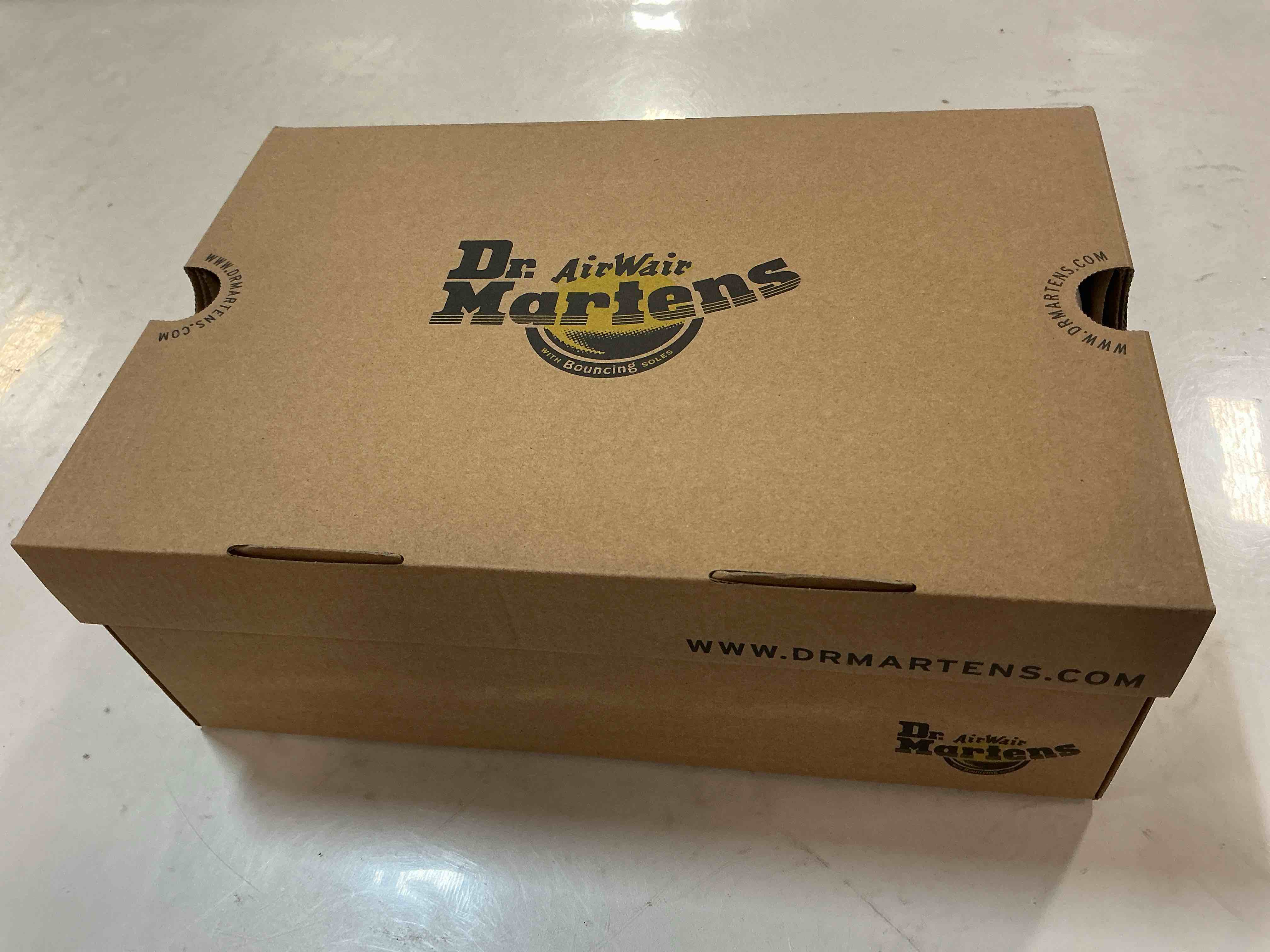 Condition photo showing New/Like New for Dr. Martens Unisex-Adult 1460 Mid Calf Boot, Black, Men’s 8/ Women’s 9 US