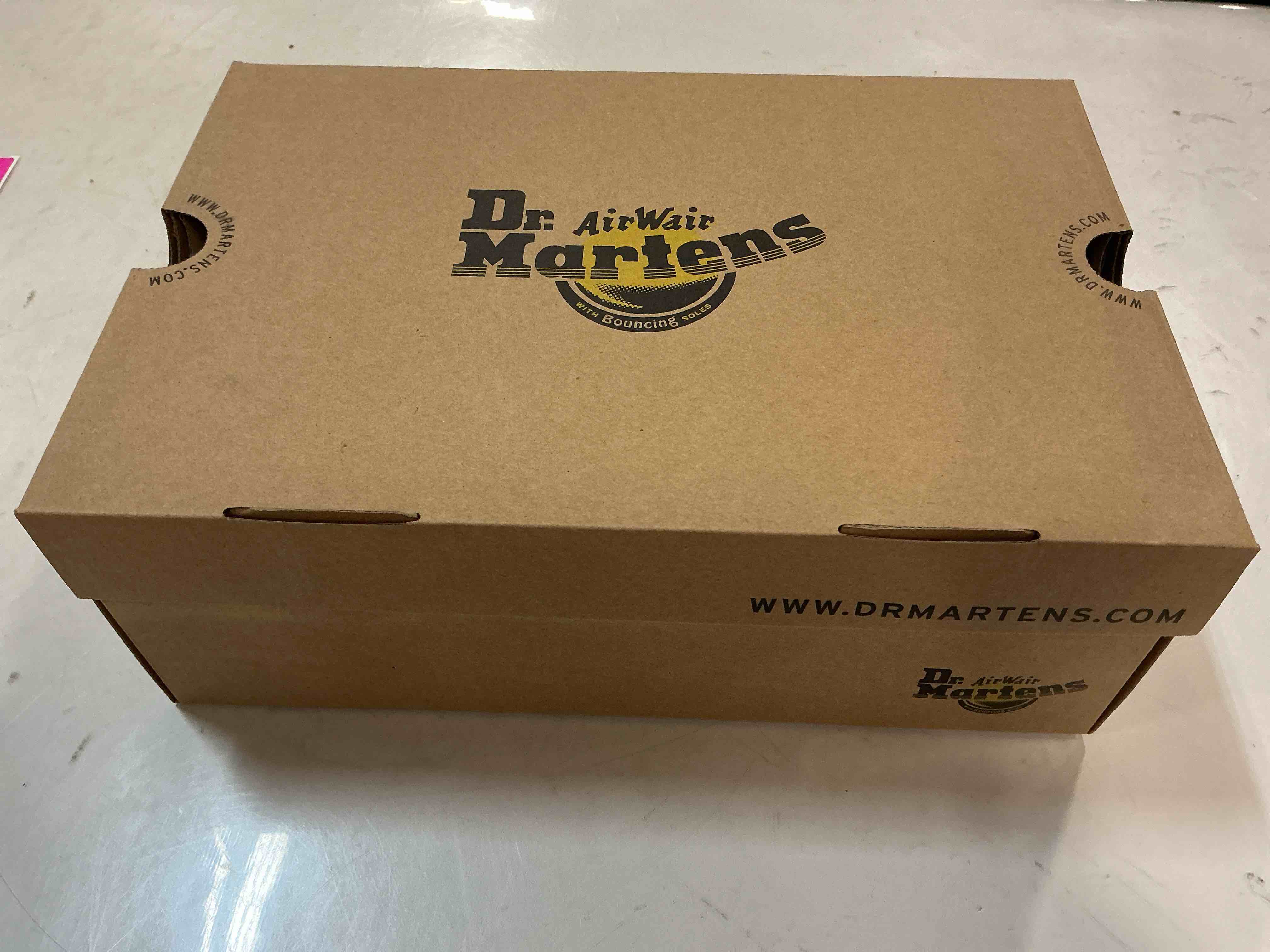 Condition photo showing New/Like New for Dr. Martens '1460' Boot in Black Smooth, Size Men’s 7/ Women’s 8