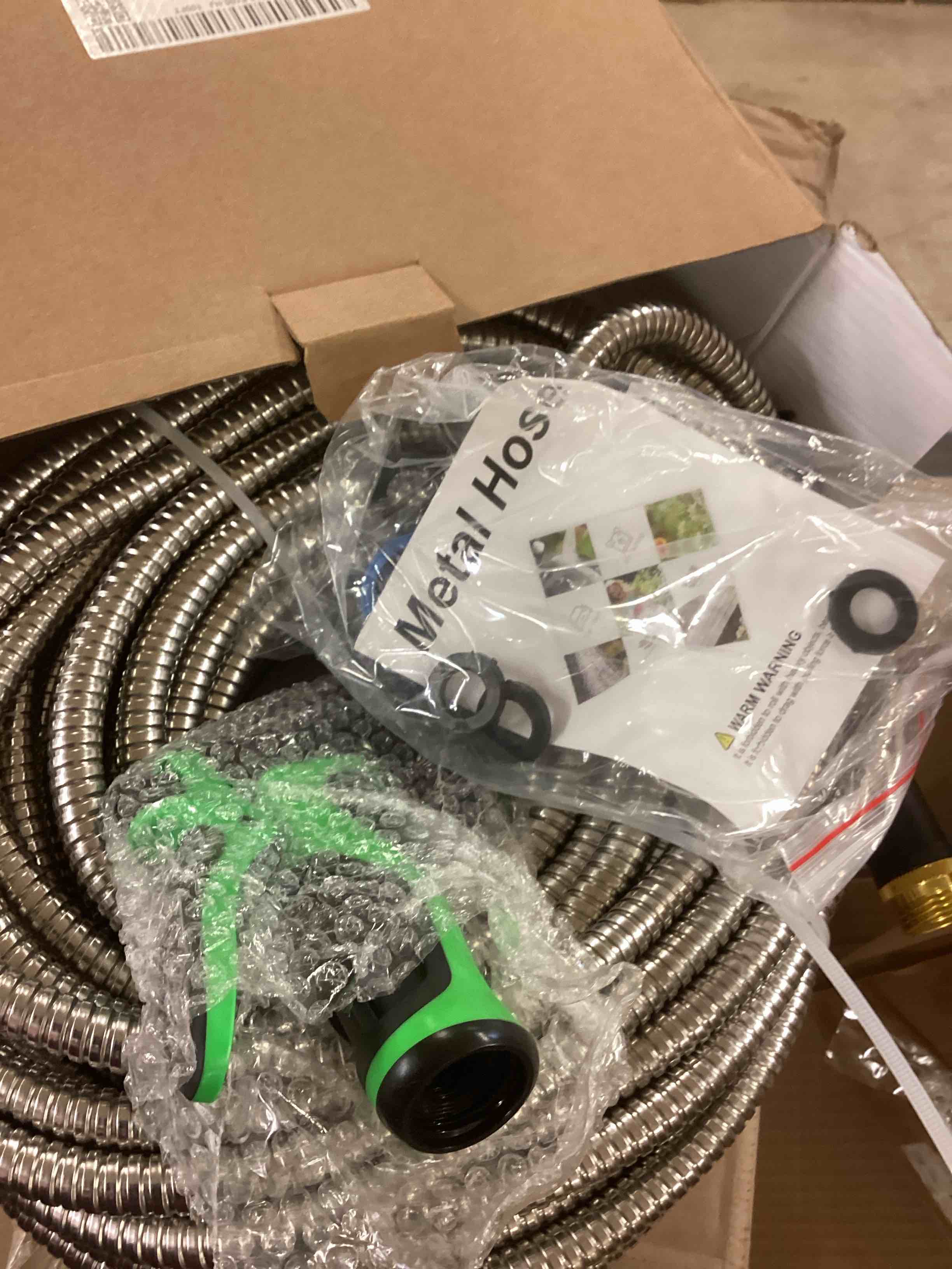 Condition photo showing item condition for stainless steel water hose 100ft