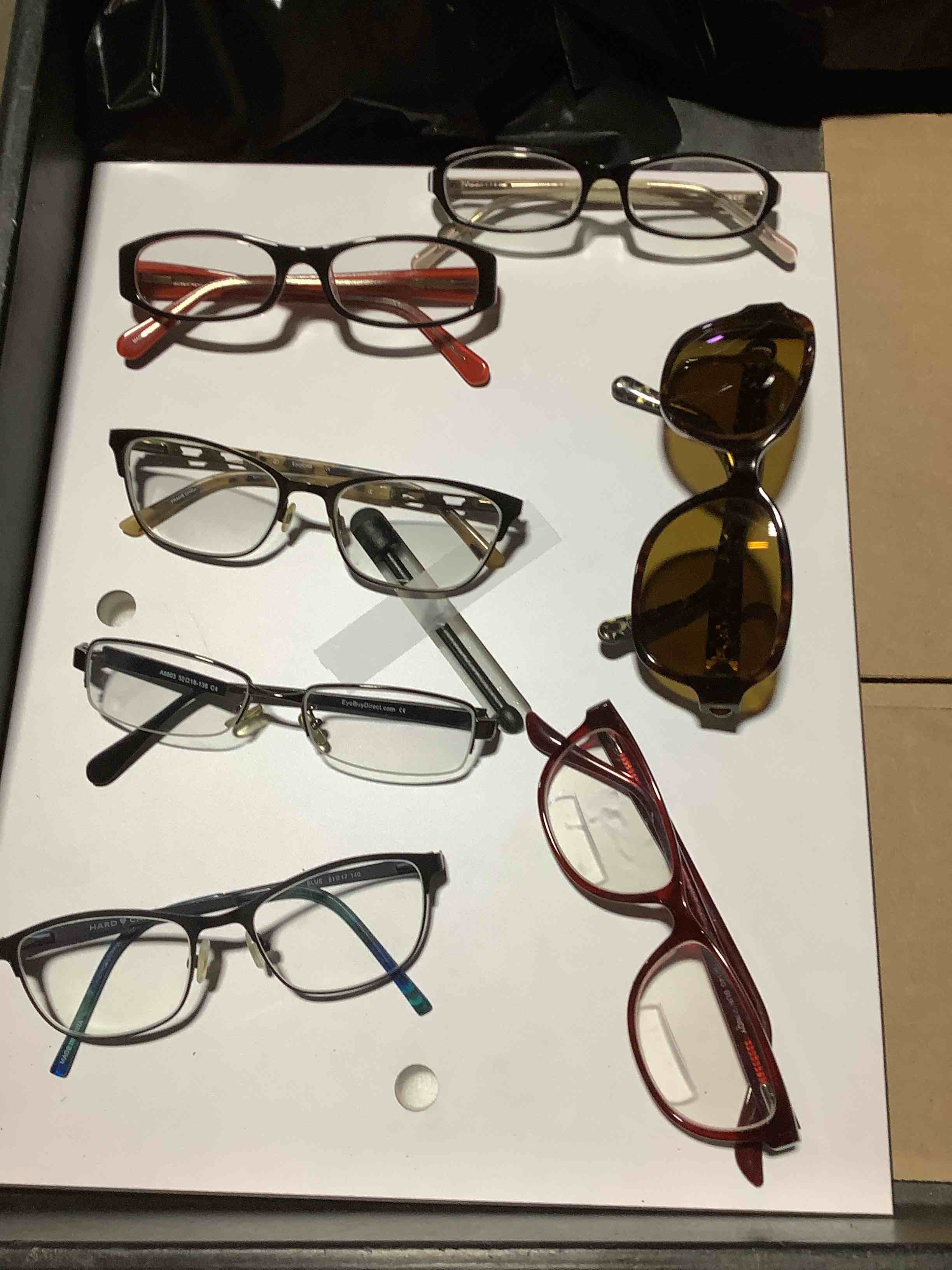 ASSORTEDOF SIGHT LENSES OF DIFFERENT TYPES AND BRANDS.