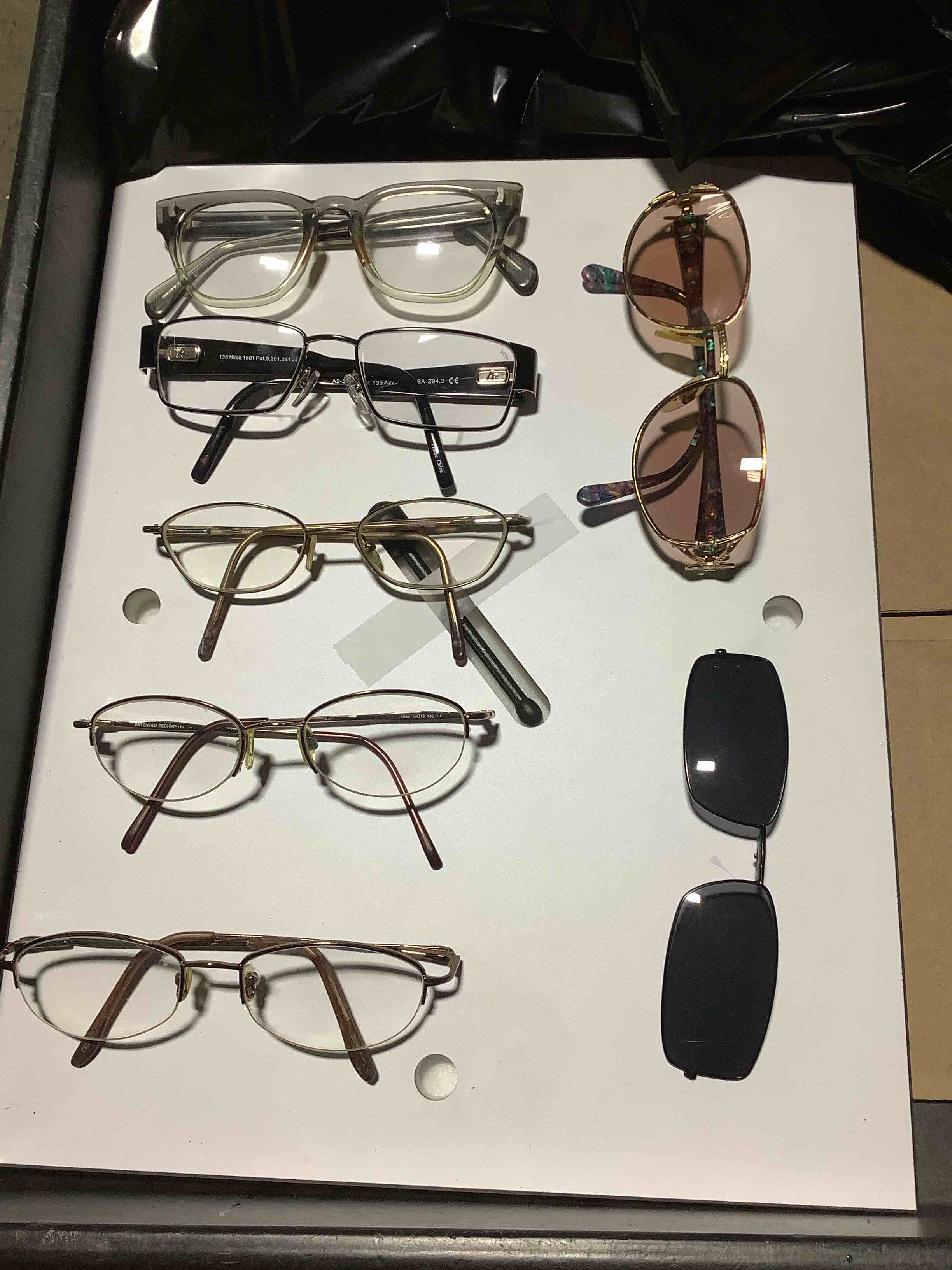 ASSORTEDOF SIGHT LENSES OF DIFFERENT TYPES AND BRANDS.