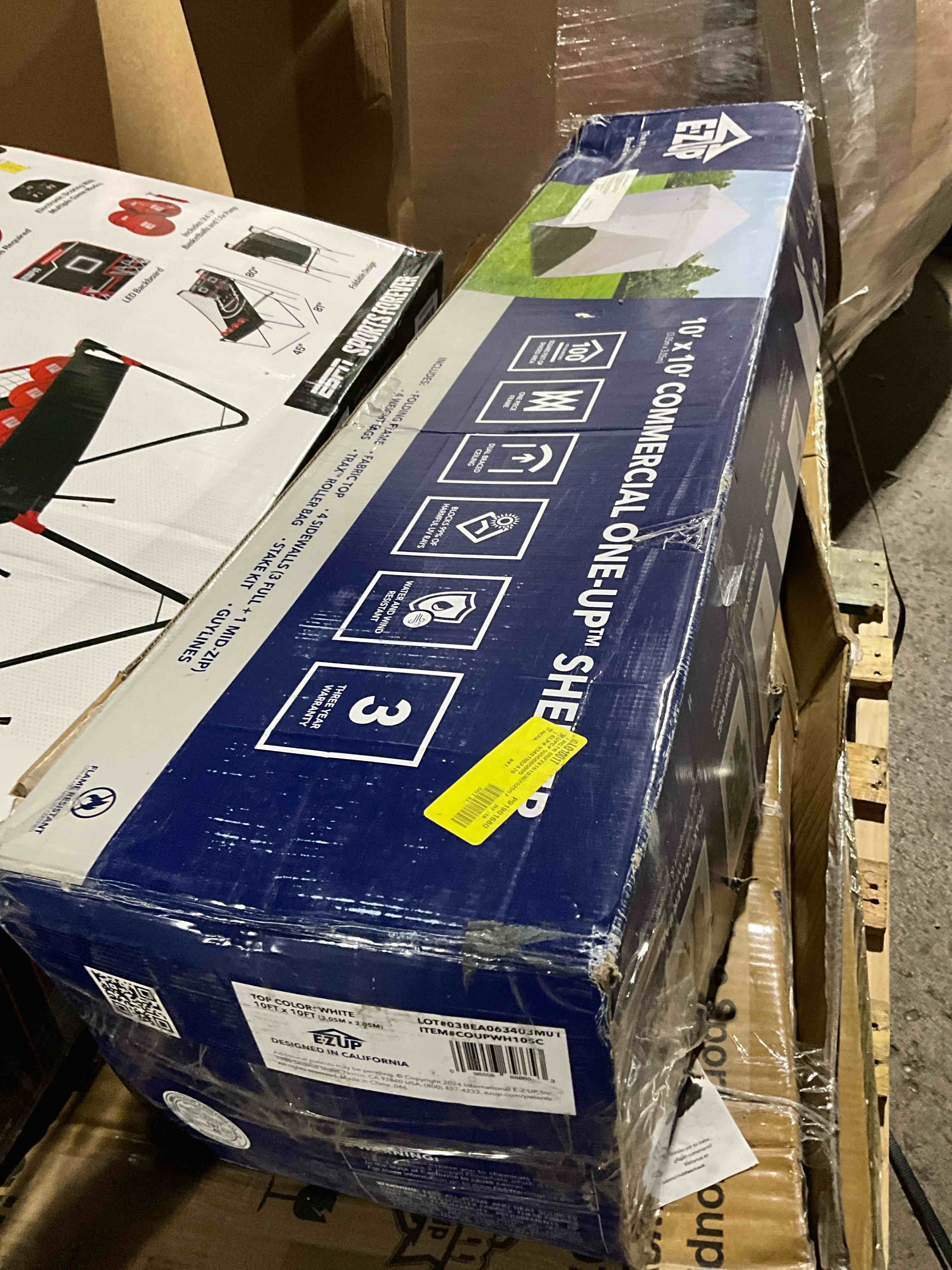 Condition photo showing Good Condition for e-z up es100s instant commercial pop up canopy tent, 10' x 10' with 3 sidewalls, 1 mid-zip sidewall and wide-trax roller bag, white