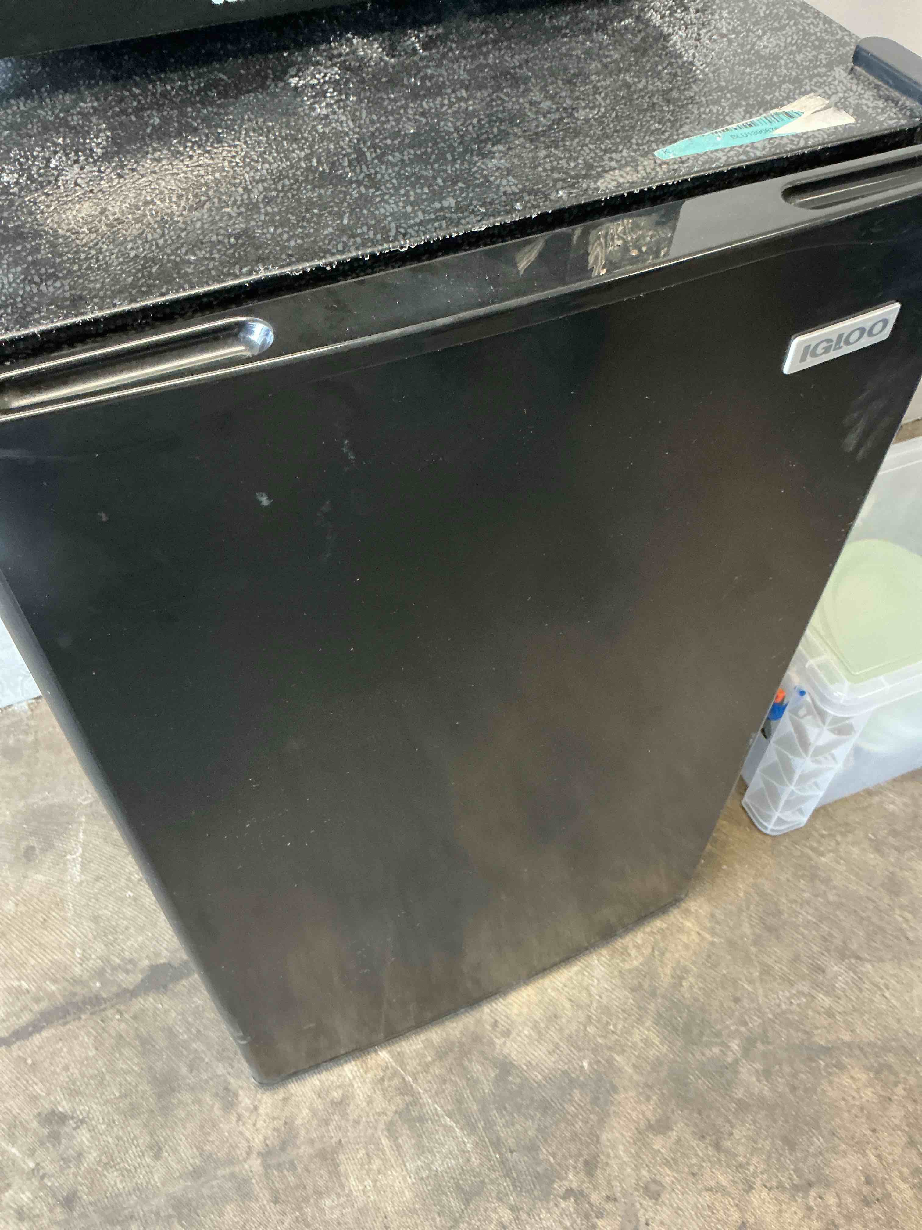 Condition photo showing As Is for Igloo 3.2 Cu.Ft. Single Door Compact Refrigerator with Freezer - Slide Out Glass Shelf, Perfect for Homes, Offices, Dorms - Black 3.2 Cu. Ft. Black