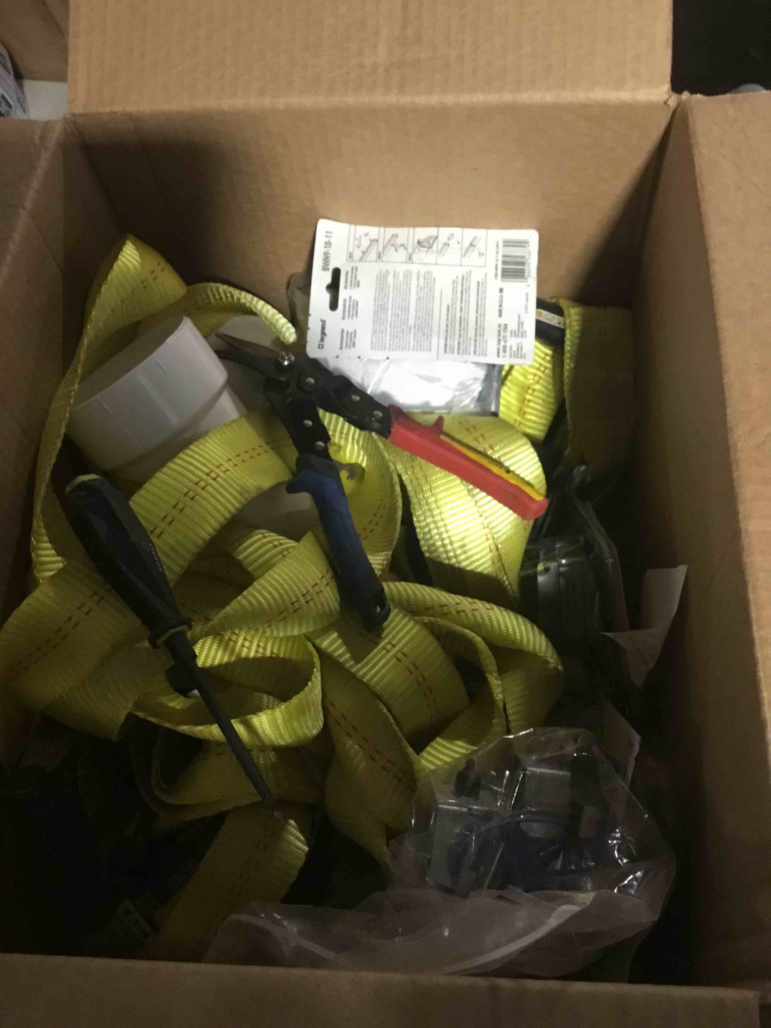 Miscellaneous box of tools, straps, electric parts