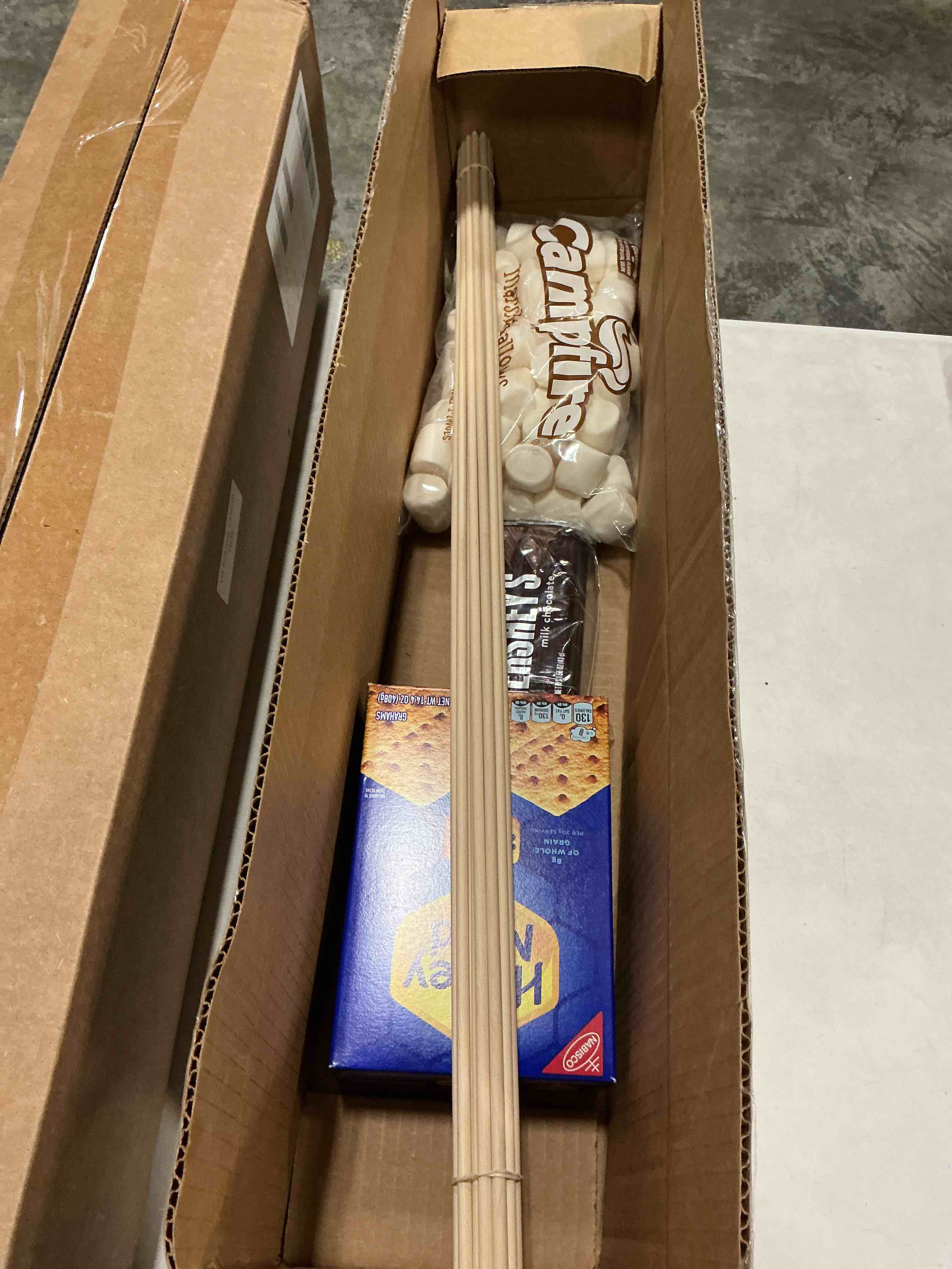 Condition photo showing New/Like New for (expires 03/26/2027) 112-piece s’mores kit – makes 24 s’mores – includes 30” birch roasting sticks, graham crackers, chocolate & marshmallows – great for camping, bonfires, parties s'mores kit