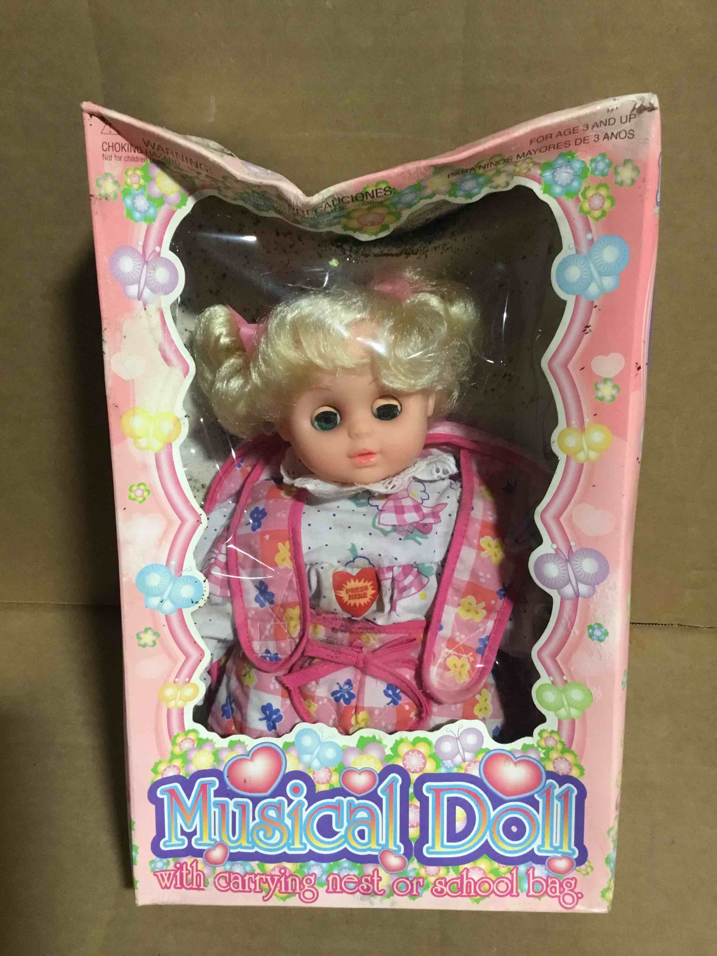 Musical Doll, with carrying nest or school bag