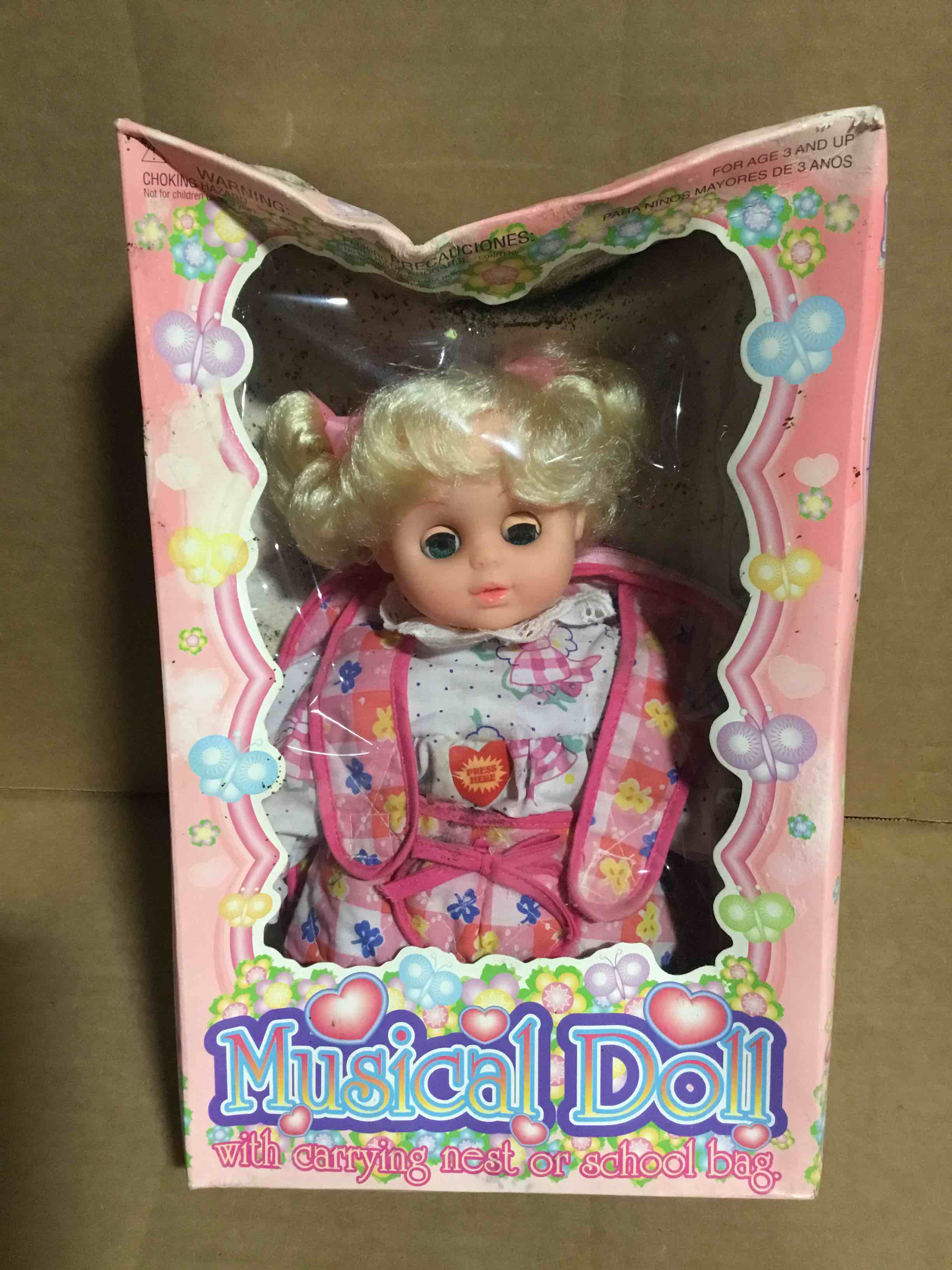Condition photo showing Good Condition for Musical Doll, with carrying nest or school bag
