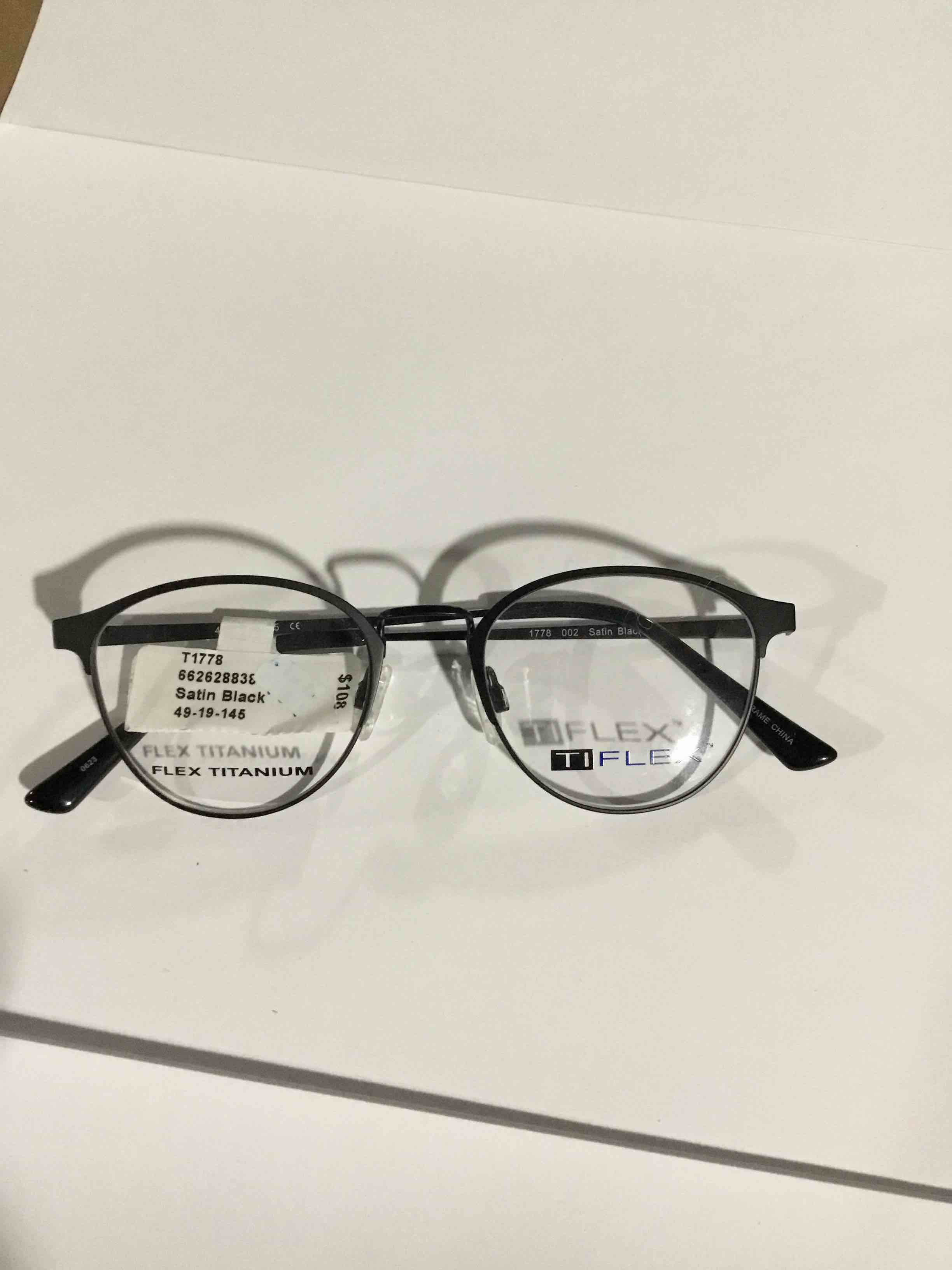 Condition photo showing New/Like New for TiFlex Men's T1778 Round Prescription Eyeglasses with Case, Black