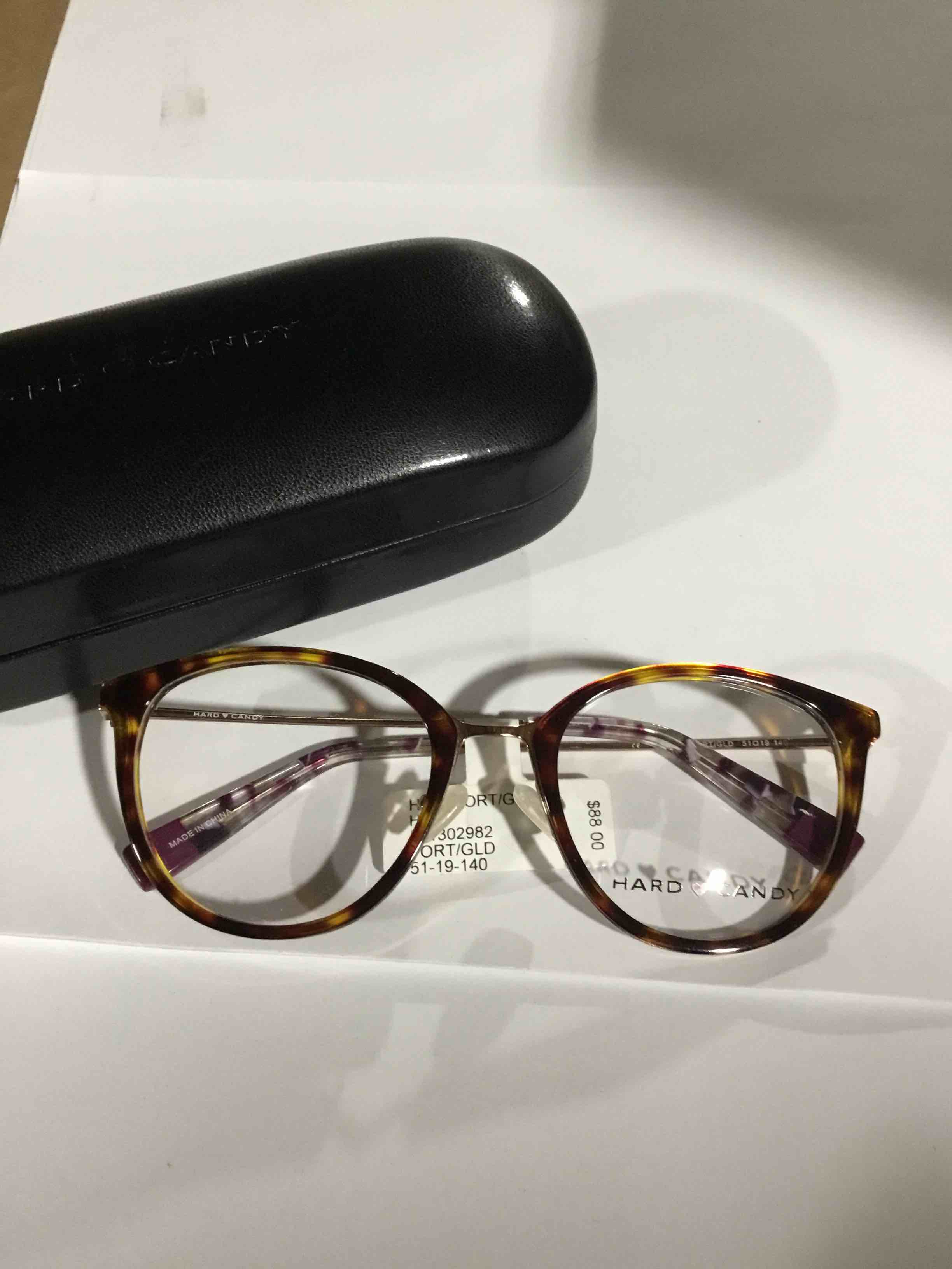 Condition photo showing New/Like New for Hard Candy Women's HC57 Round Prescription Eyeglasses with Case, Gold Tortoise