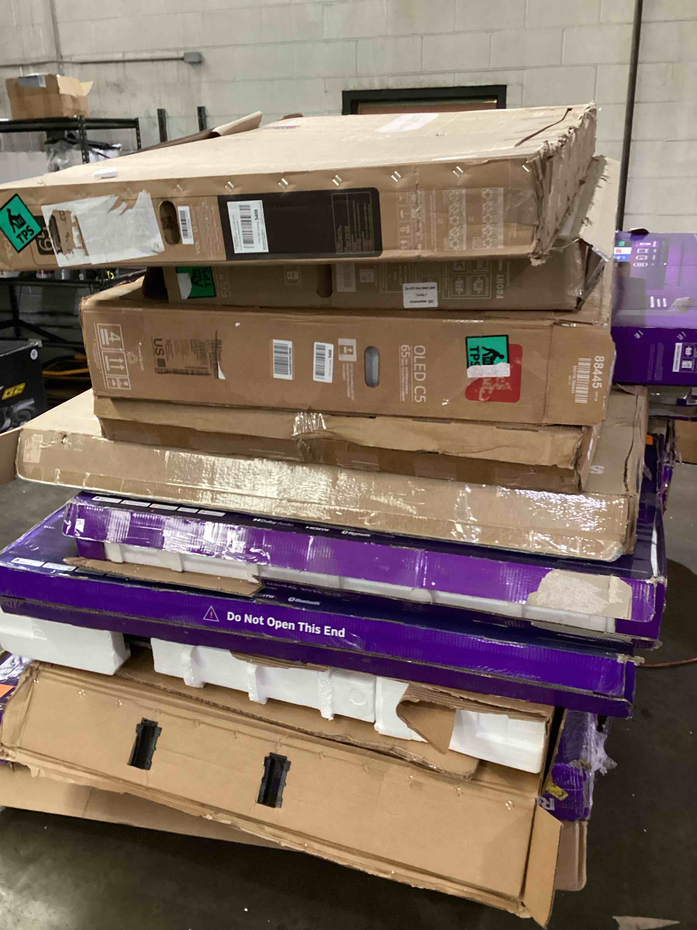 pallet of broken tvs