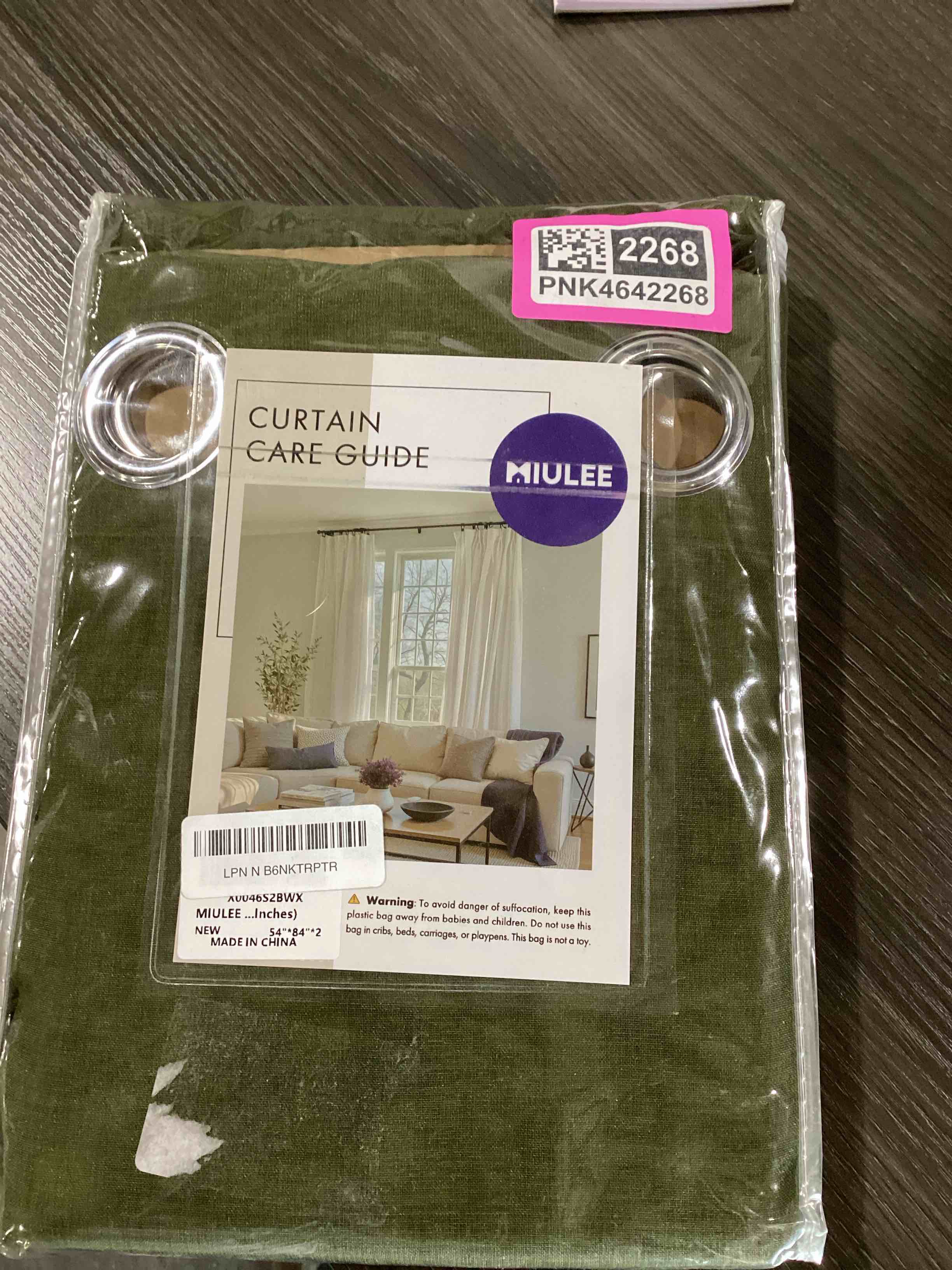 Condition photo showing New/Like New for miulee 2 panels olive green semi sheer window curtains elegant grommet top window voile drapes/treatment linen textured dark green panels for bedroom living room (54x84 inches) olive green 54"w x 84"l (pack of 2)