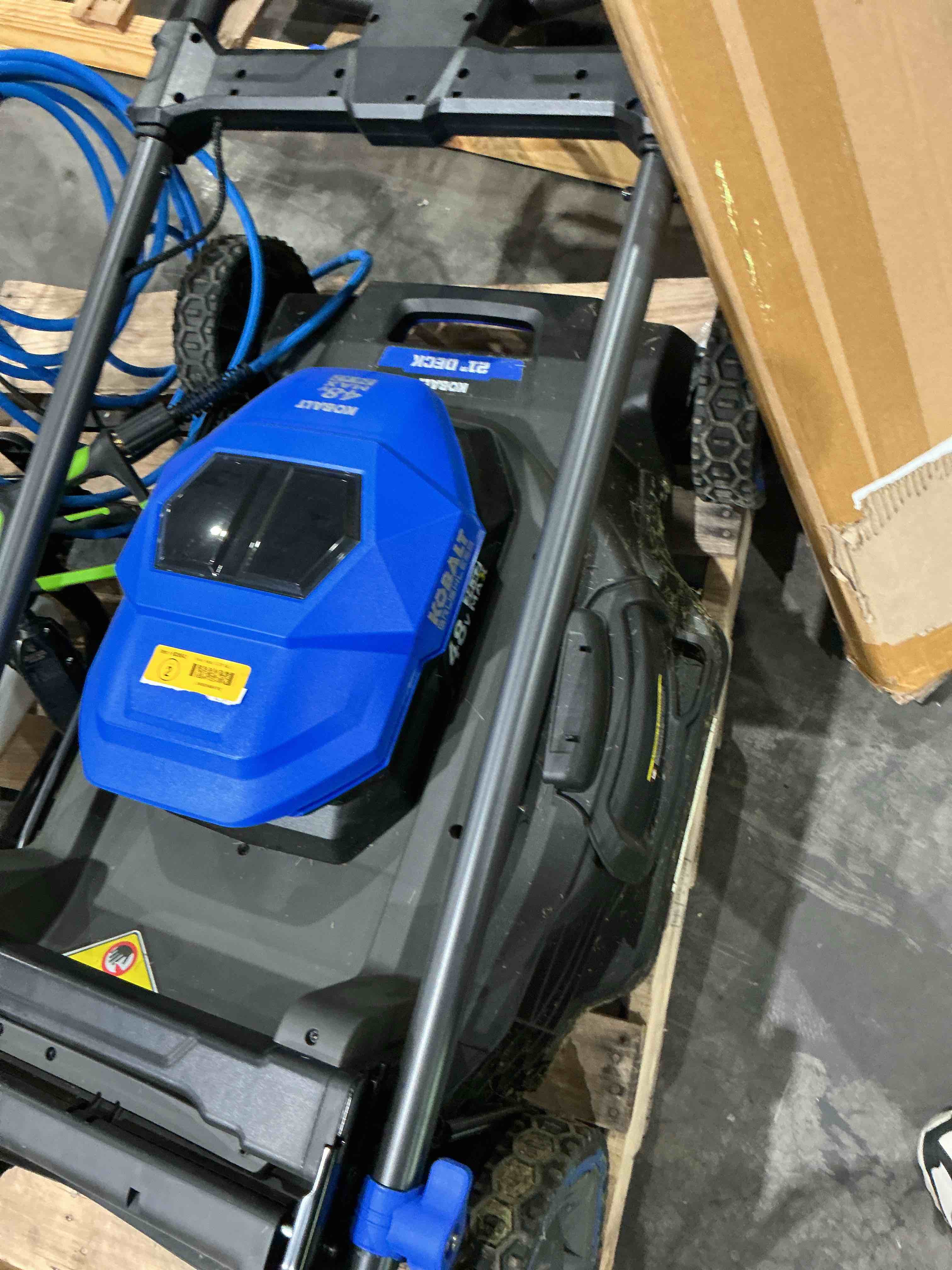 Condition photo showing As Is for kobalt 48v max (24vx2) 21-in self-propelled mower kit, (2) 6.0ah batteries and charger included