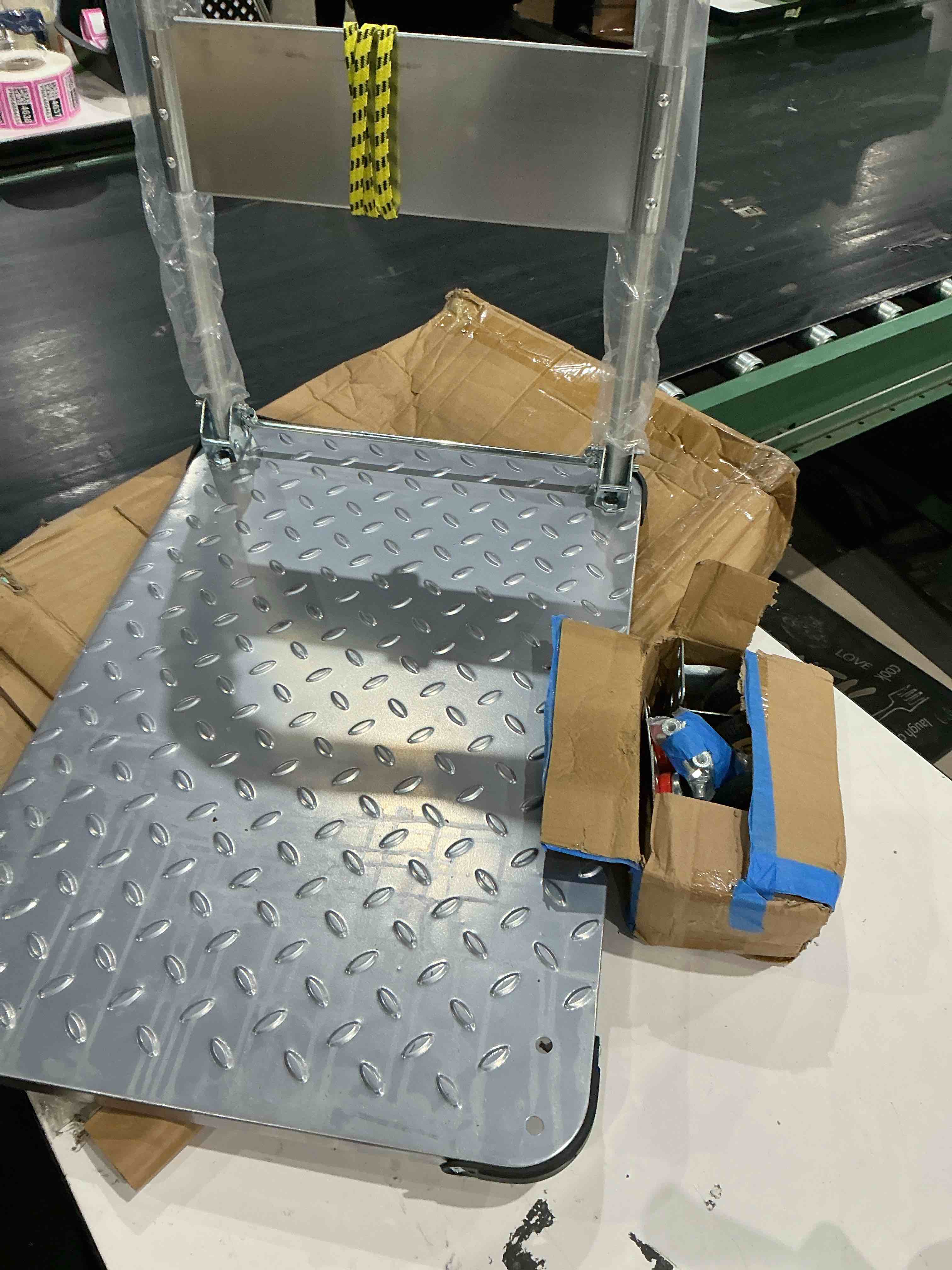 Condition photo showing As Is for unknown brand. anti slip platform warehouse hand truck heavy duty steel trolley