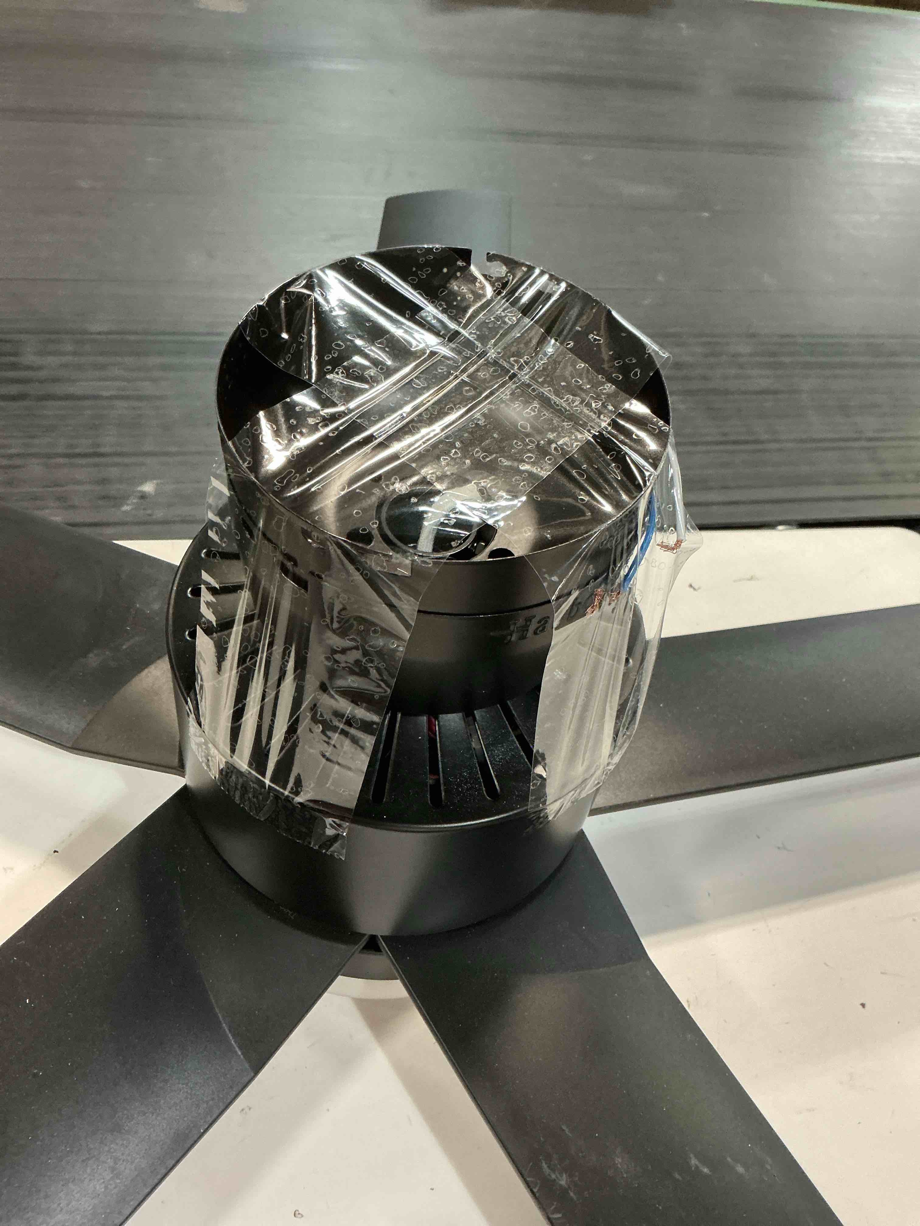 Condition photo showing As Is for  harbor breeze sunport easy2hang 44-in matte black with matte blades led covered outdoor