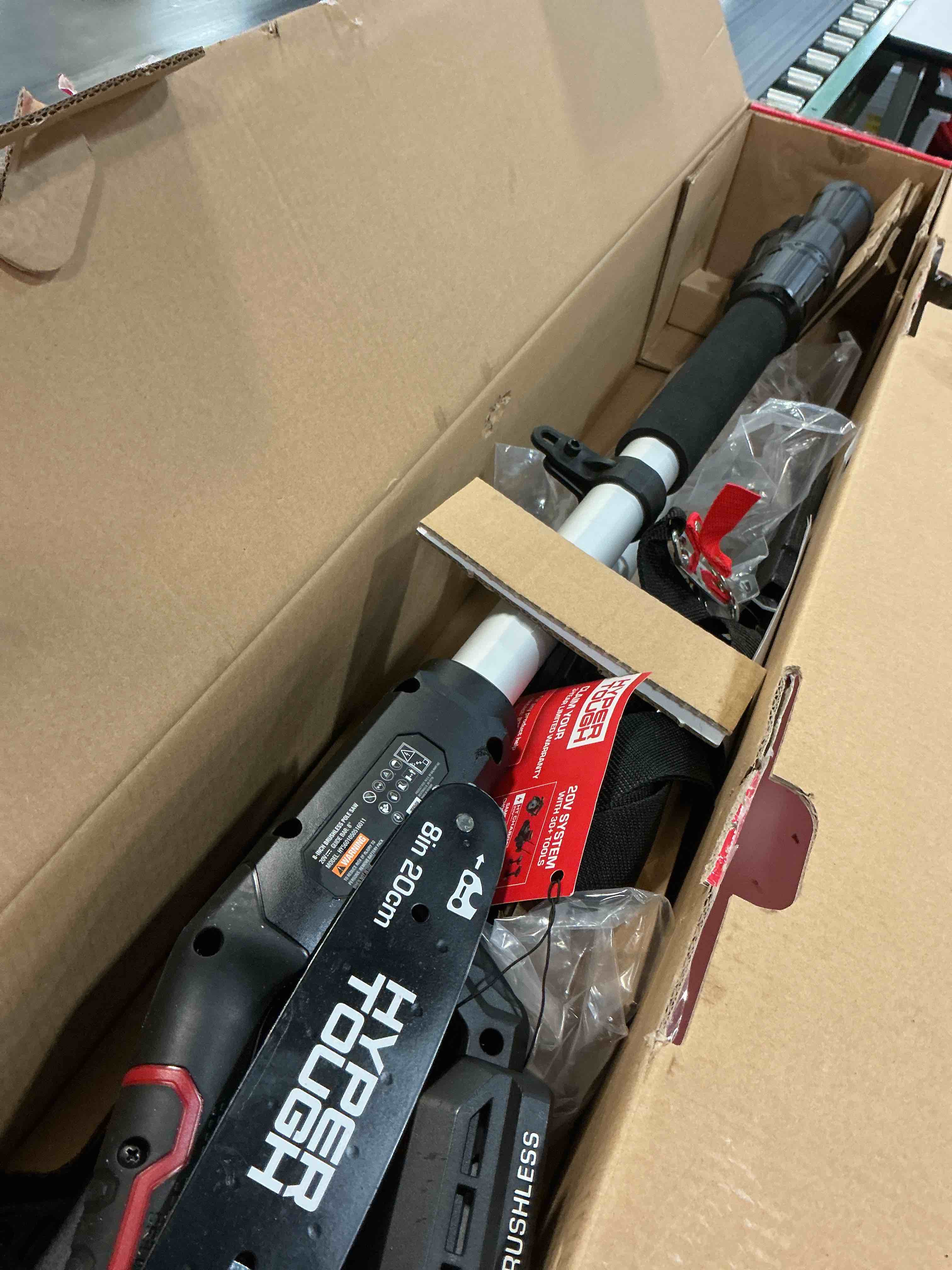 Condition photo showing As Is for hyper tough 8" 20v brushless cordless pole saw with 20v max 2.0ah battery and charging cable