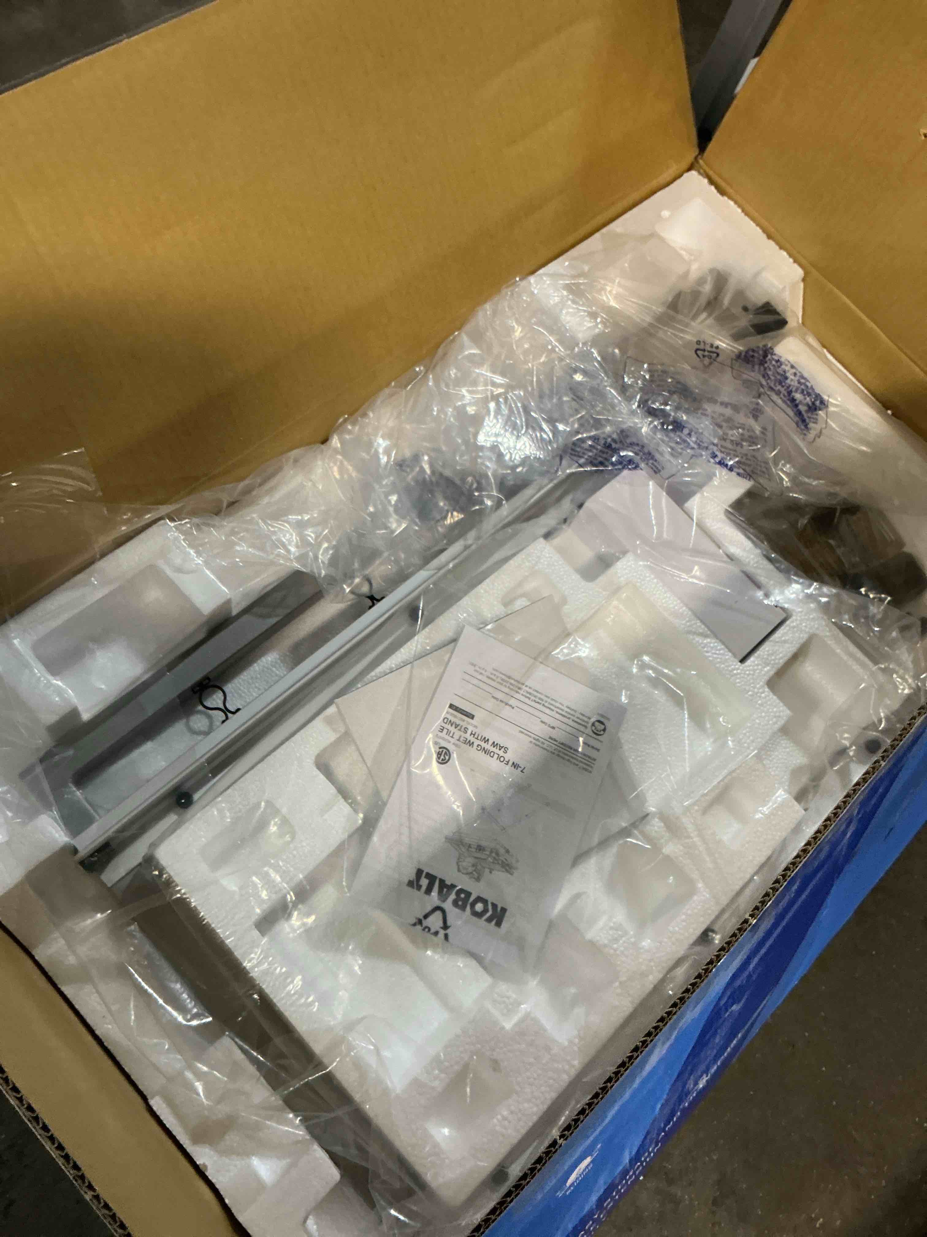 Condition photo showing As Is for kobalt folding head 9 -amp 7-in -blade sliding table tile saw with stand