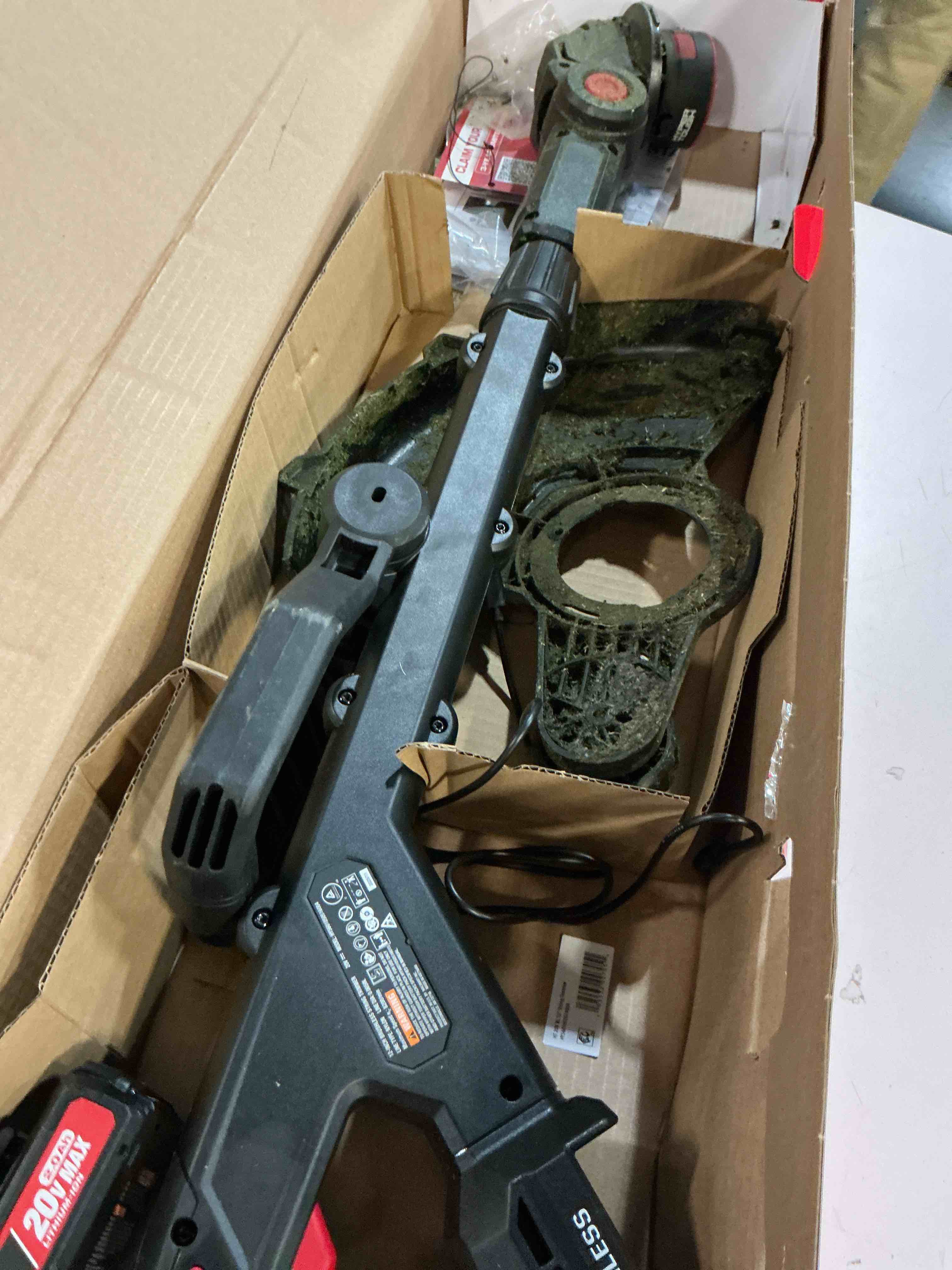 Condition photo showing As Is for hyper tough 12" 20v brushless cordless string trimmer with 20v max 2.0ah battery