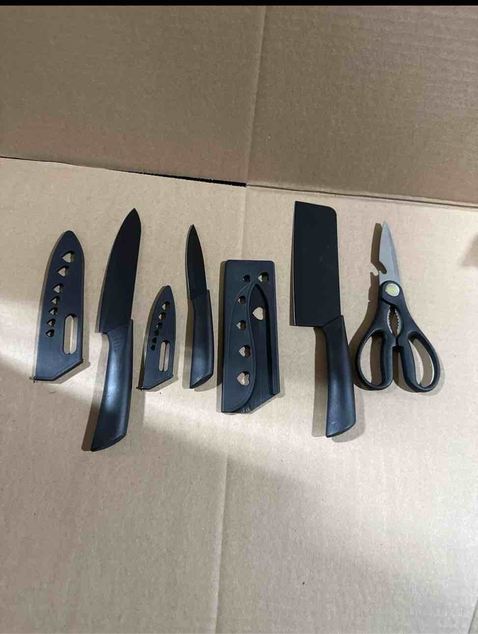 Condition photo showing Brand New for sleek 4-piece black kitchen knife set with ergonomic handles and matching shears, designed for sharp precision and everyday meal prep. 