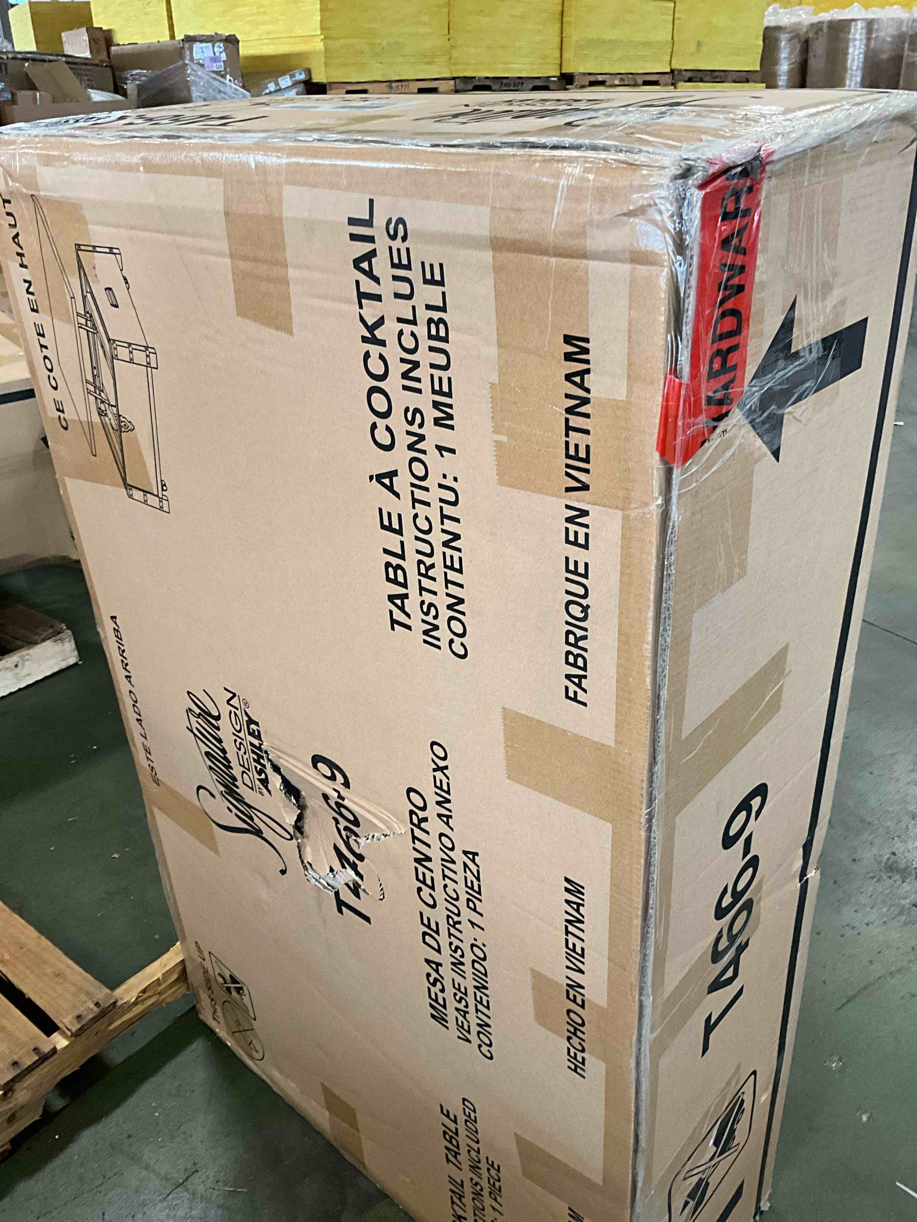 Condition photo showing New/Like New for hollum 47 in. brown rectangle wood coffee table