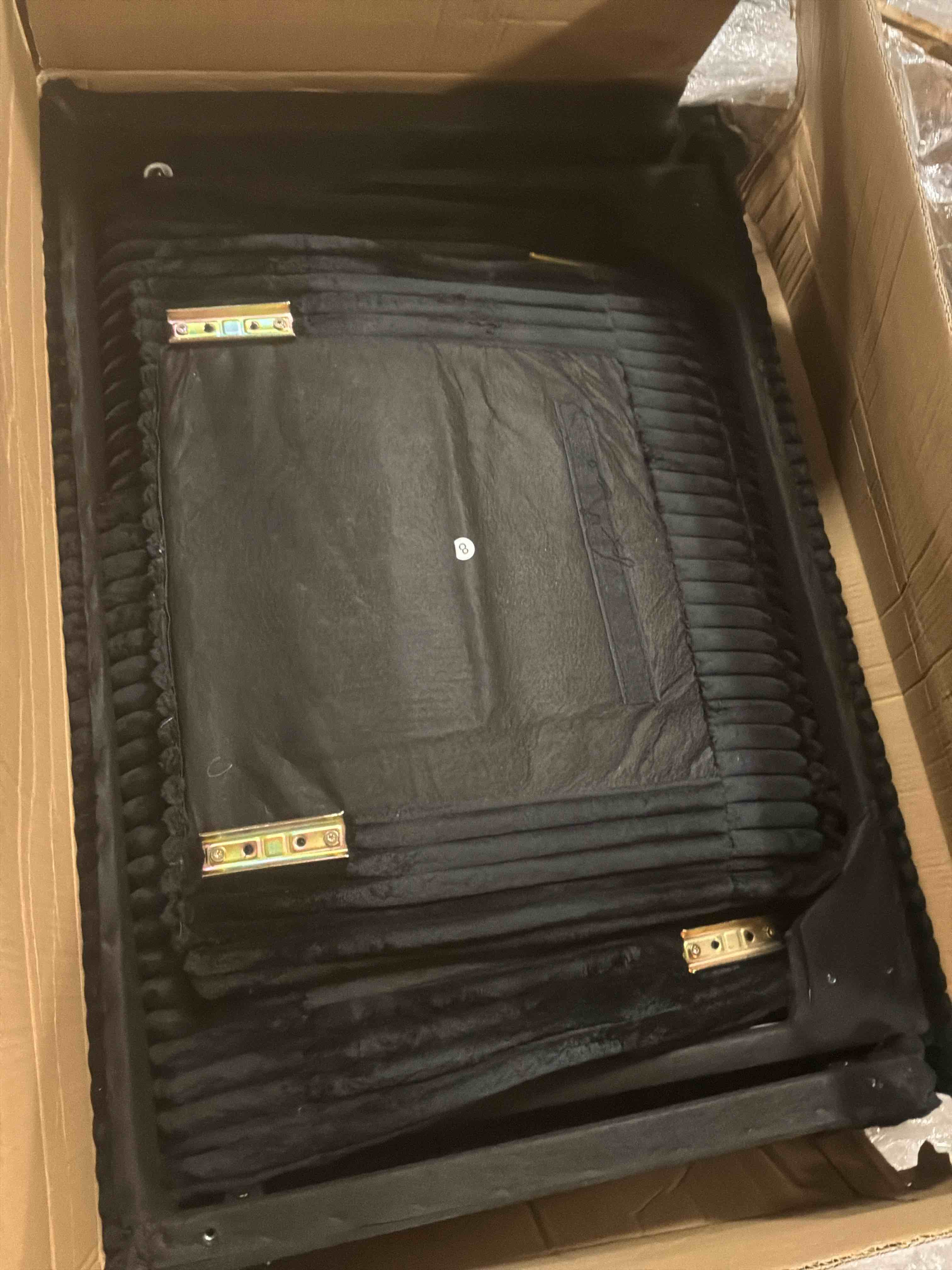 Parts of a Black Sofa