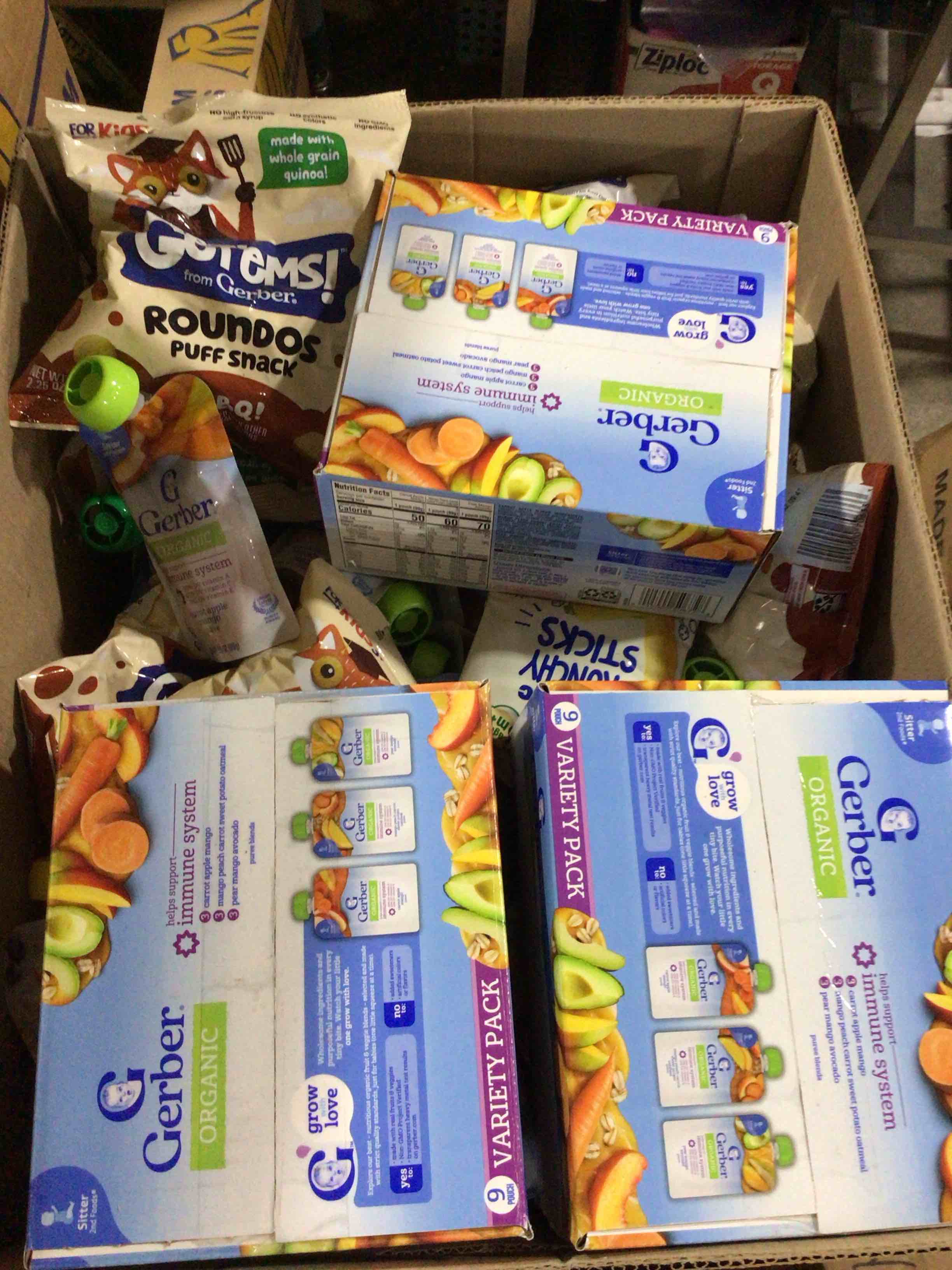 box of assorted grocery products / baby food / snacks