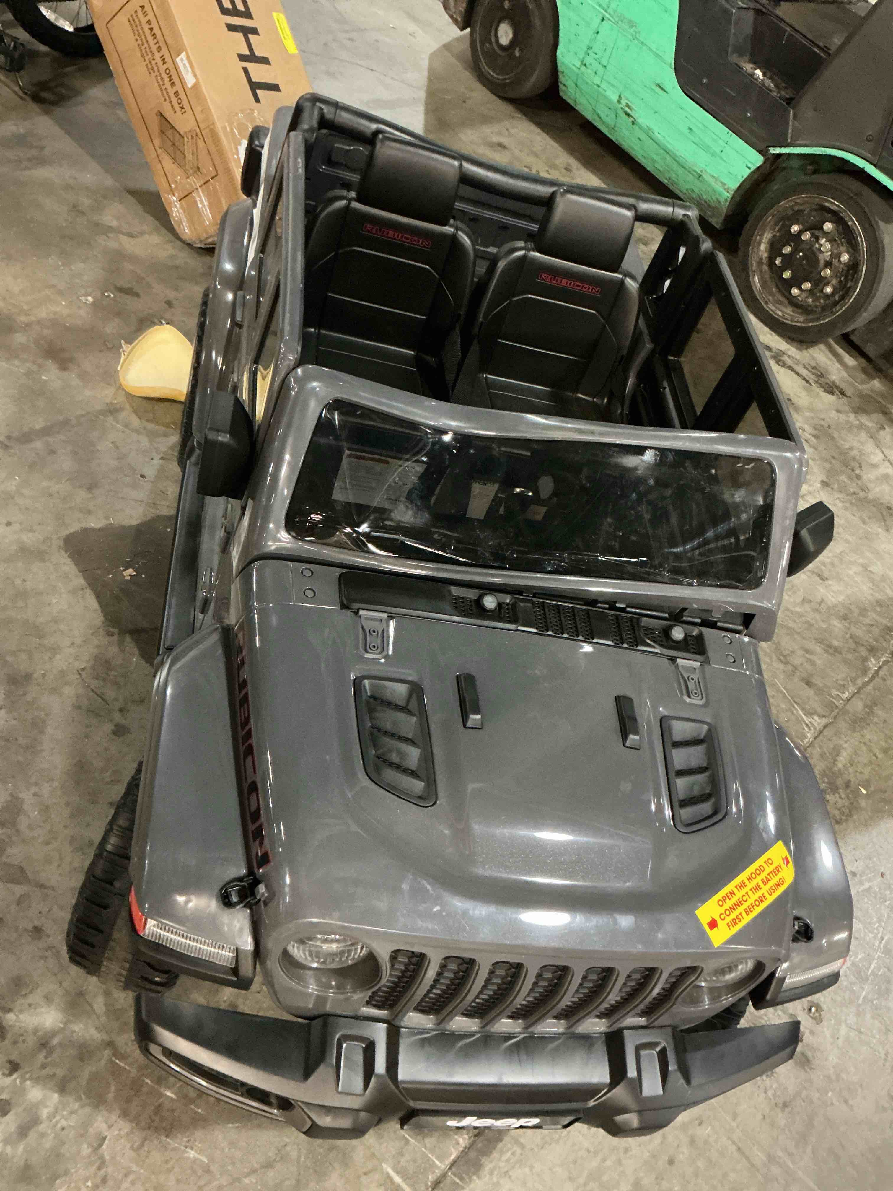Condition photo showing As Is for jeep gladiator rubicon battery-powered vehicle w/ sound effects, ages 3+, grey