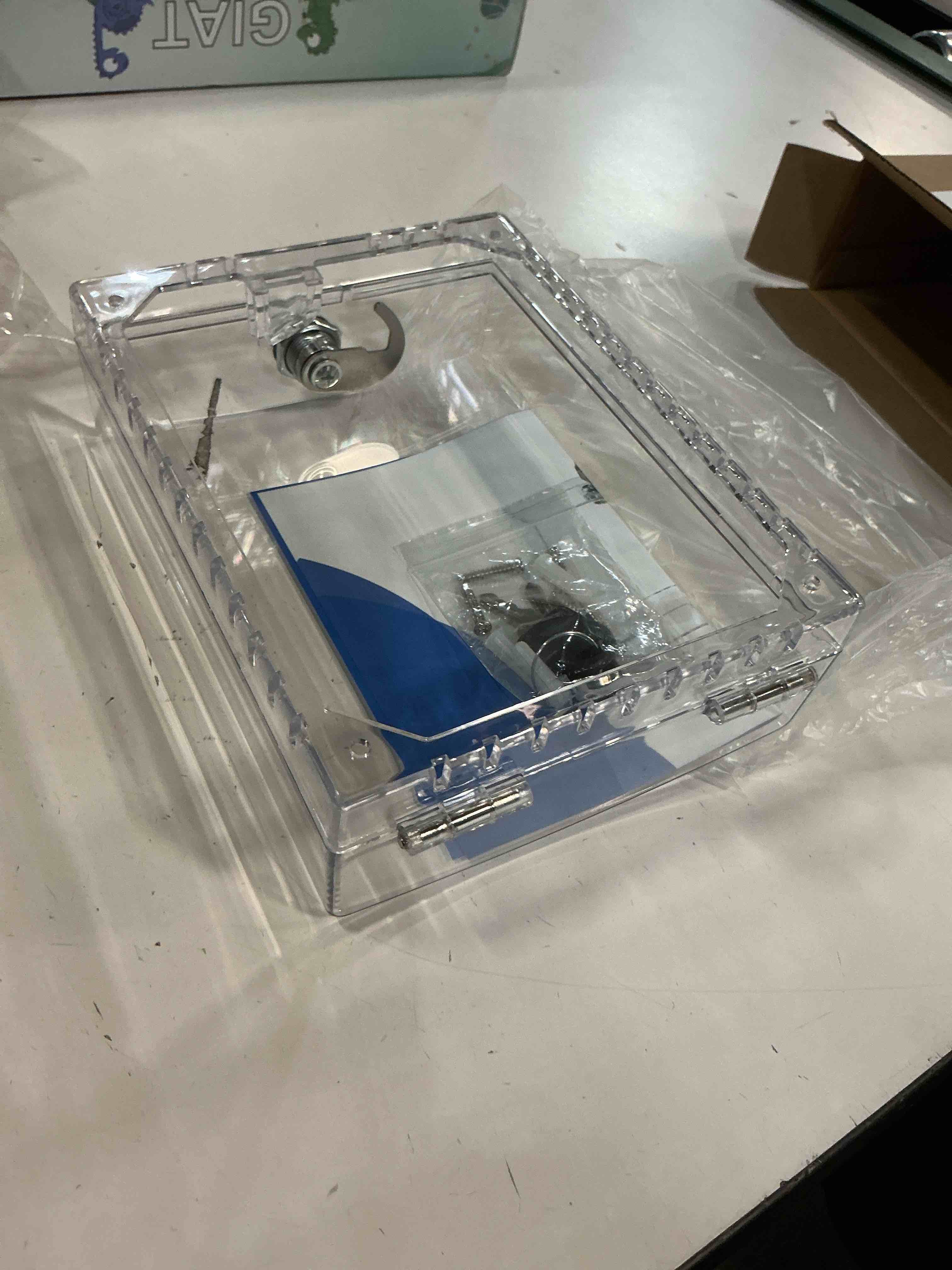 Condition photo showing New/Like New for large thermostat lock box cover with key, clear thermostat cover with lock compatible with honeywell home thermostat on wall, ac lock box cover with key fits thermostats 5"h x 6" w or smaller 1 pcs key lock