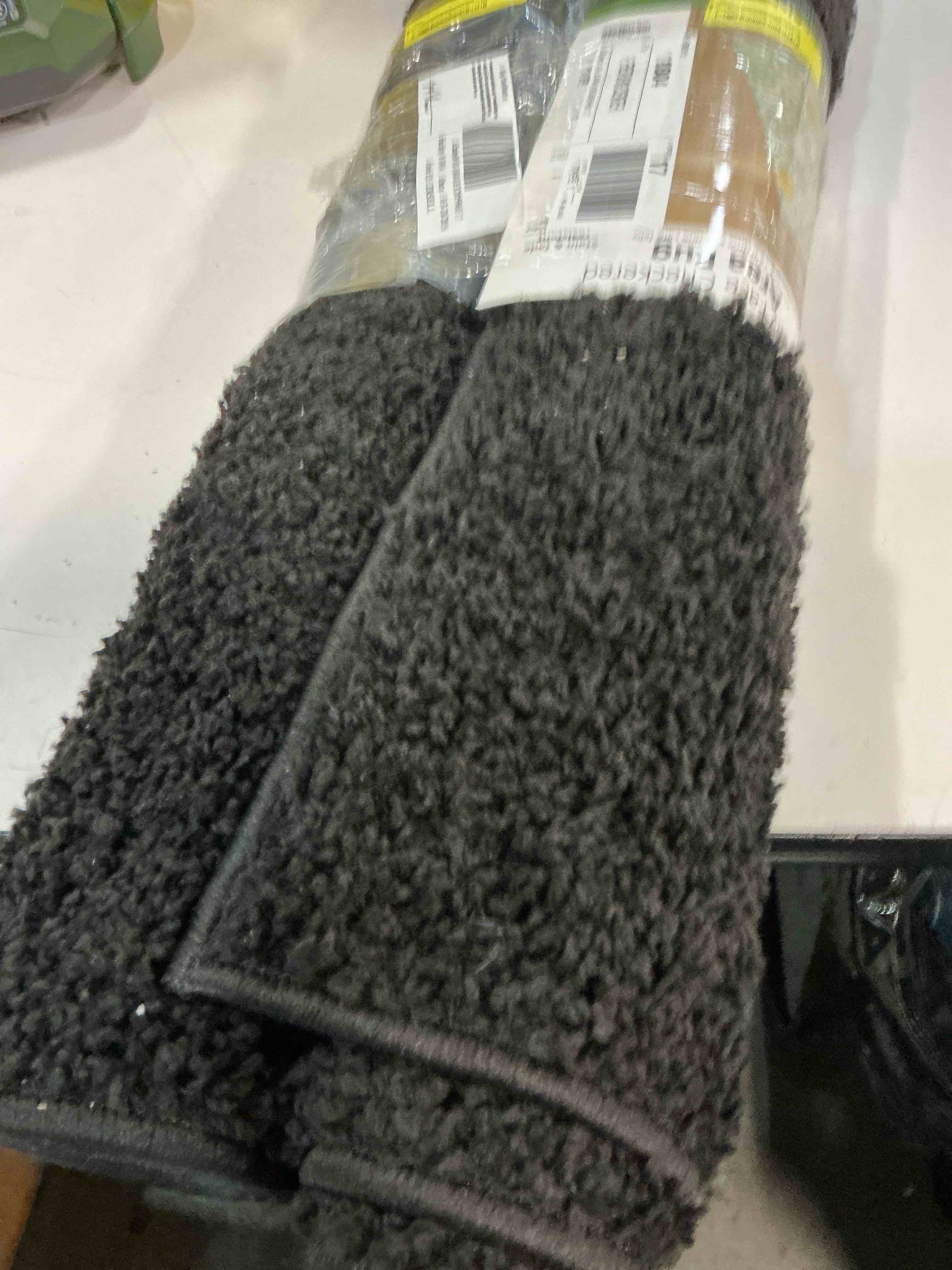 Condition photo showing Good Condition for mainstays new youth happy face area rug  2  6  x 4  9 (color and pattern may vary ours are solid black)