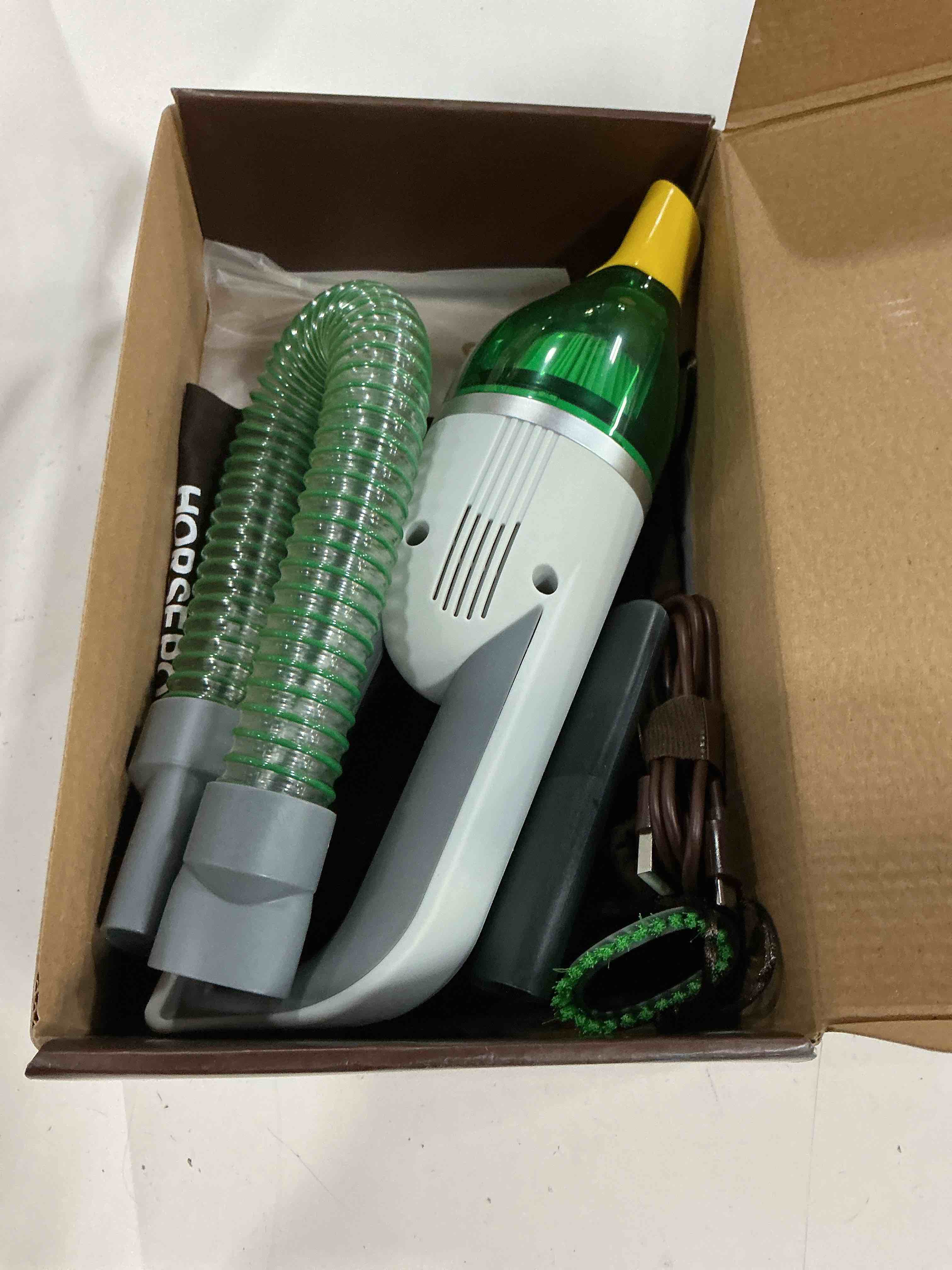 Condition photo showing As Is for 6080995 duck bagless cordless filter bag compact vacuum, white