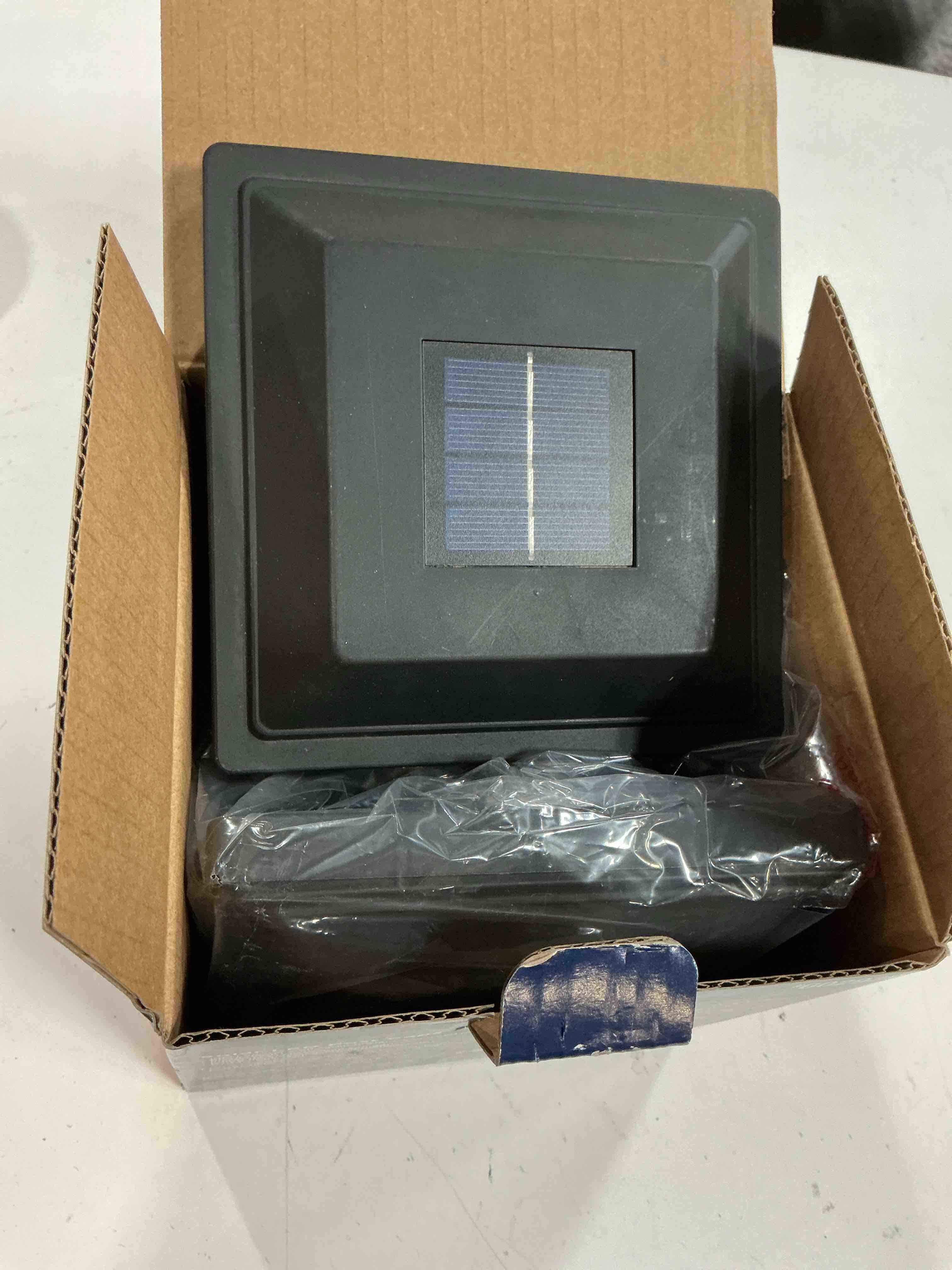 Condition photo showing As Is for harbor breeze solar 4-in x 4-in matte black led outdoor post cap light 2 -pack
