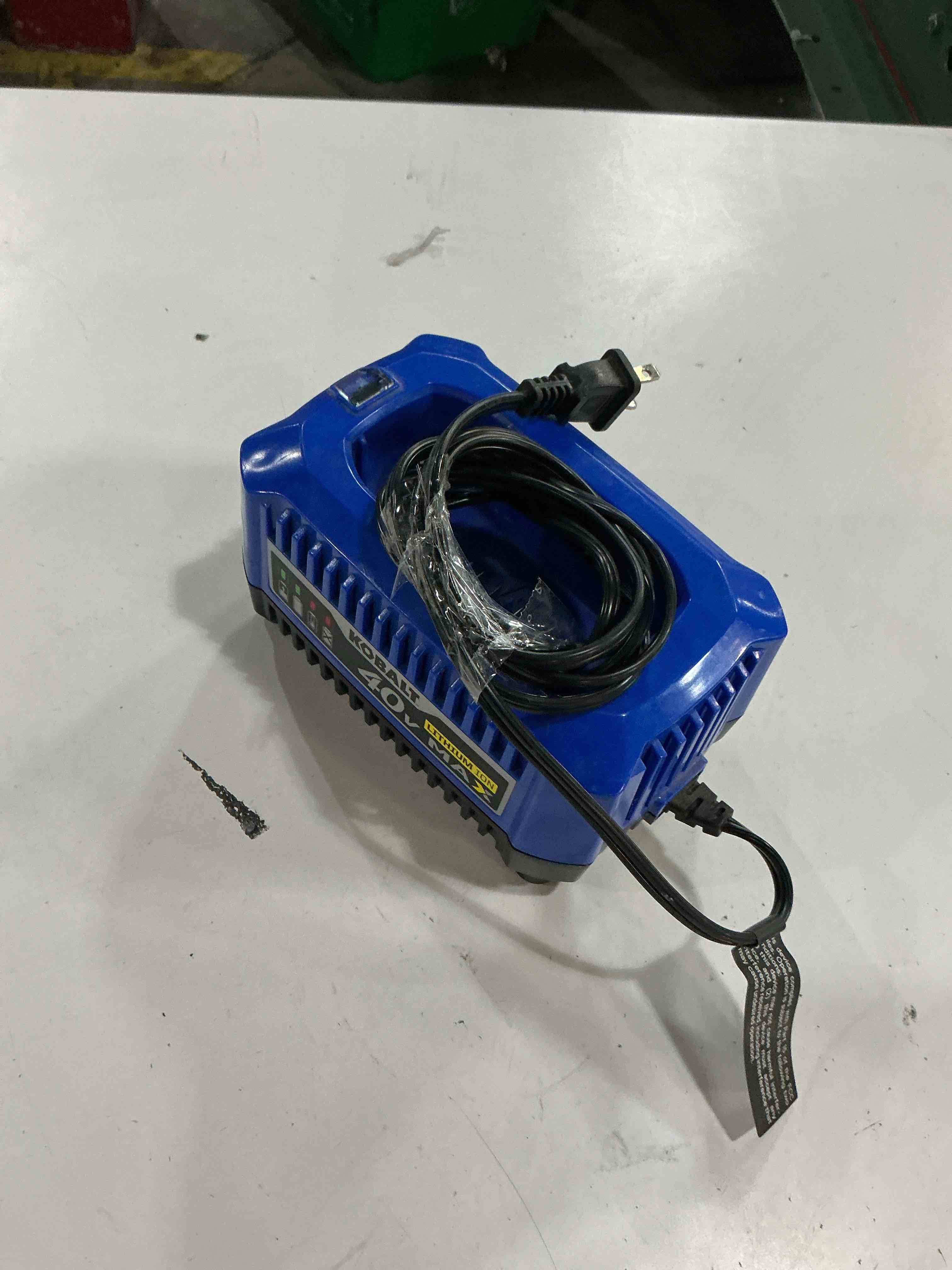 Condition photo showing As Is for kobalt battery charger
