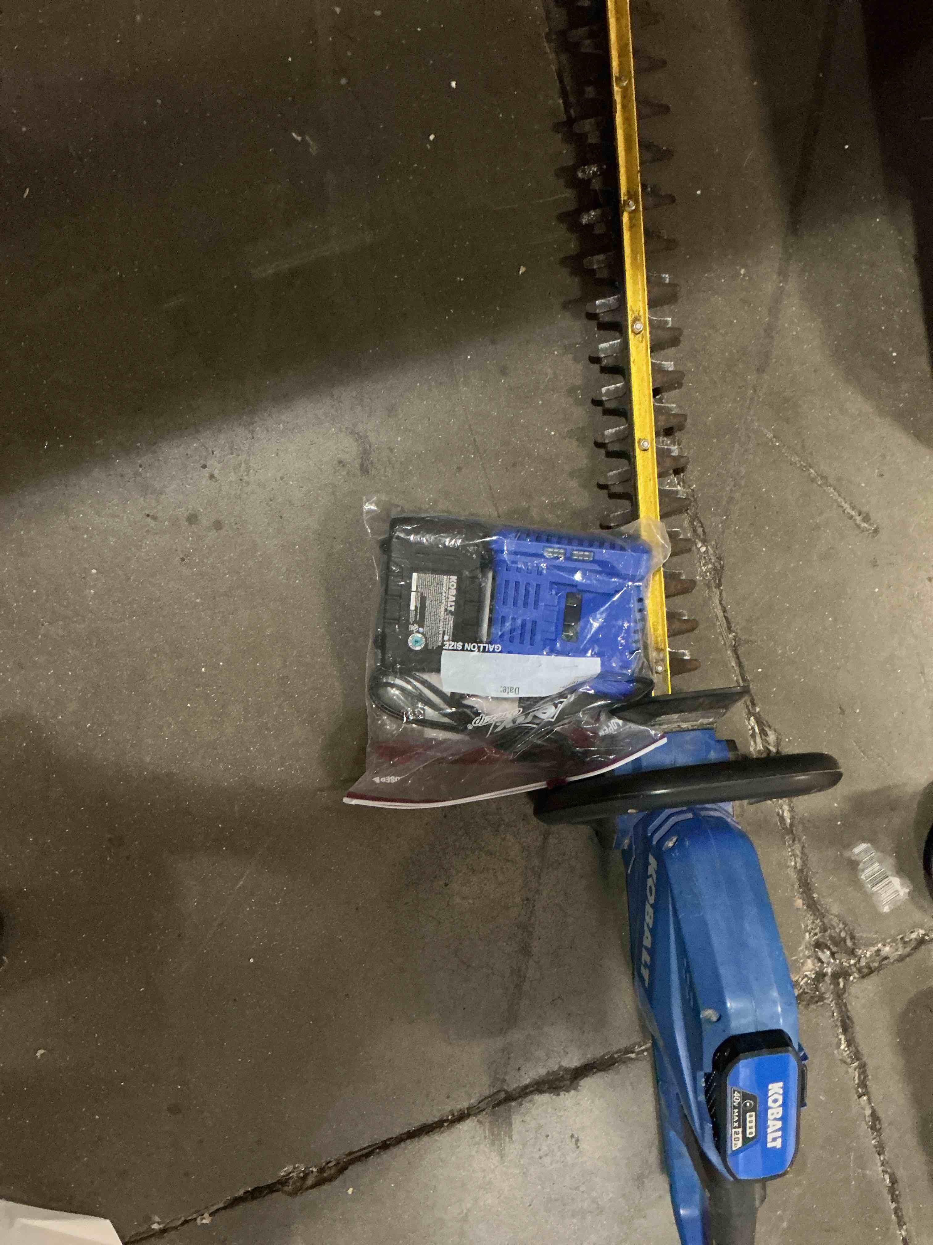Condition photo showing As Is for kobalt gen4 40-volt 24-in battery hedge trimmer 2.0 ah battery included , charger included