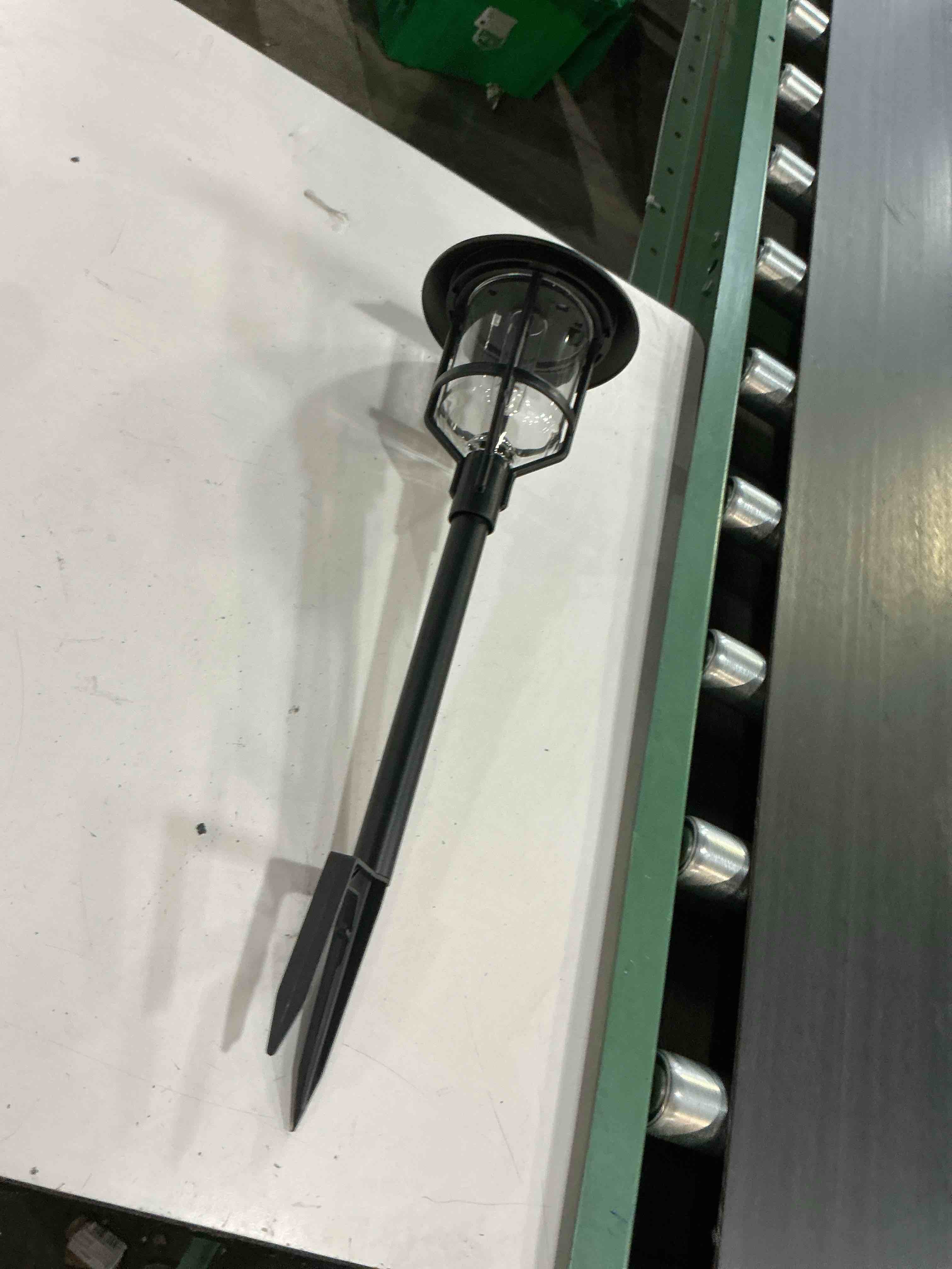 Condition photo showing As Is for harbor breeze path light 10 -lumens black solar led outdoor path light ( 3000-k )