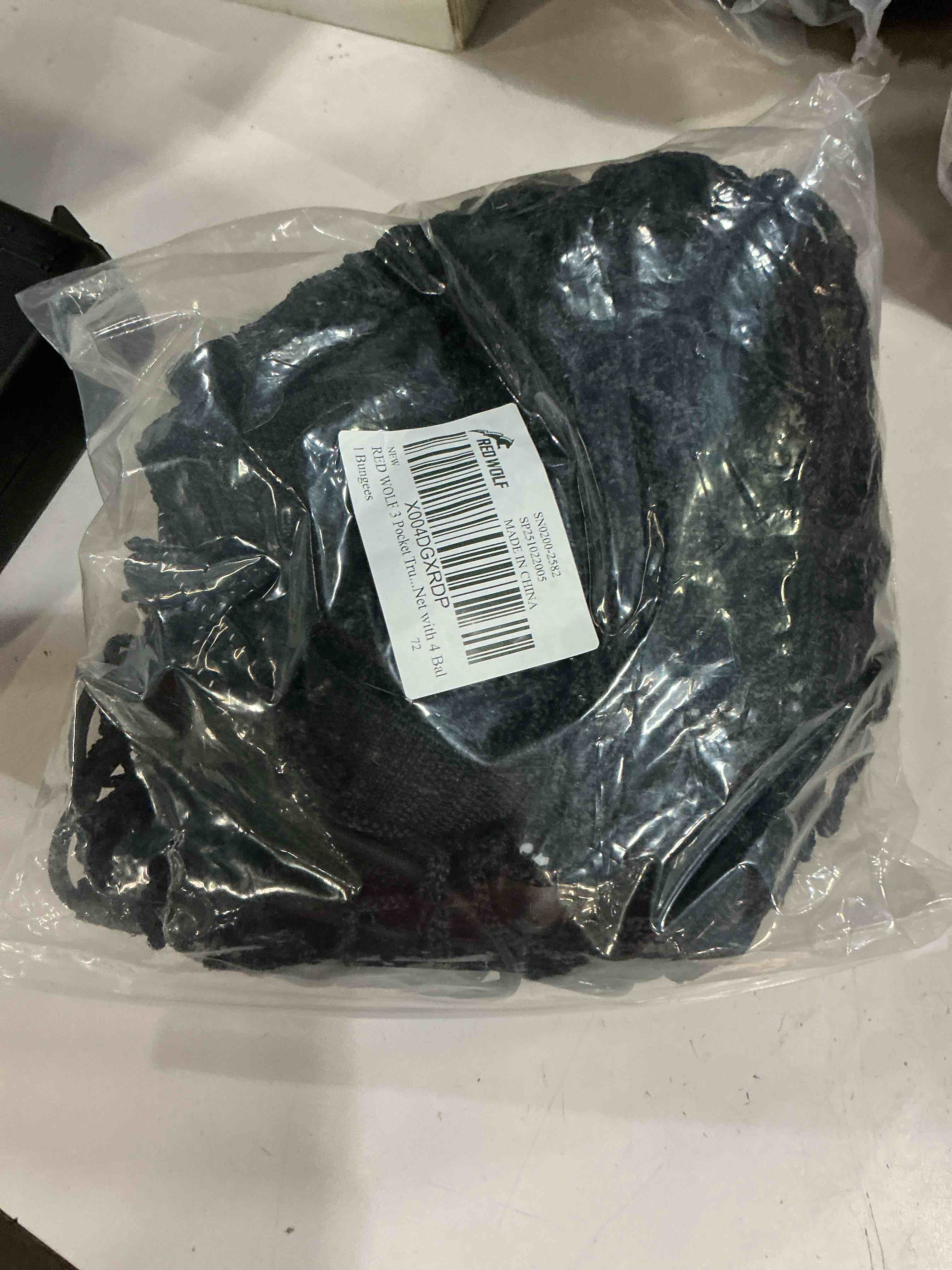 Condition photo showing Good Condition for red wolf 3 pocket truck bed cargo net for toyota ford dodge gmc chevy silverado, universal pickup mesh storage net 47.2" x 11.8" stretchable elastic truck bed grocery holder net with 4 ball bungees