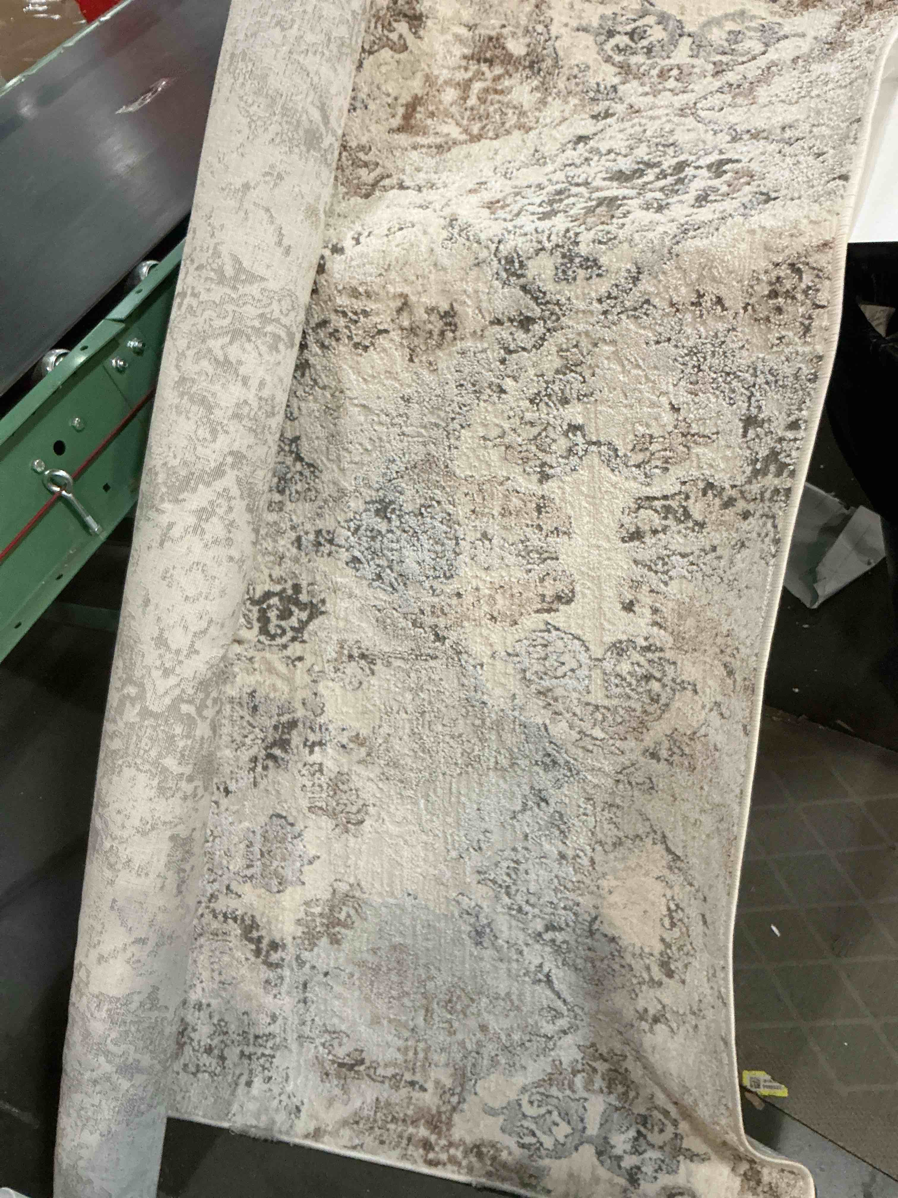 Condition photo showing As Is for allen + roth andromeda 5 x 7 (ft) loomed polyester beige rectangular indoor spot clean