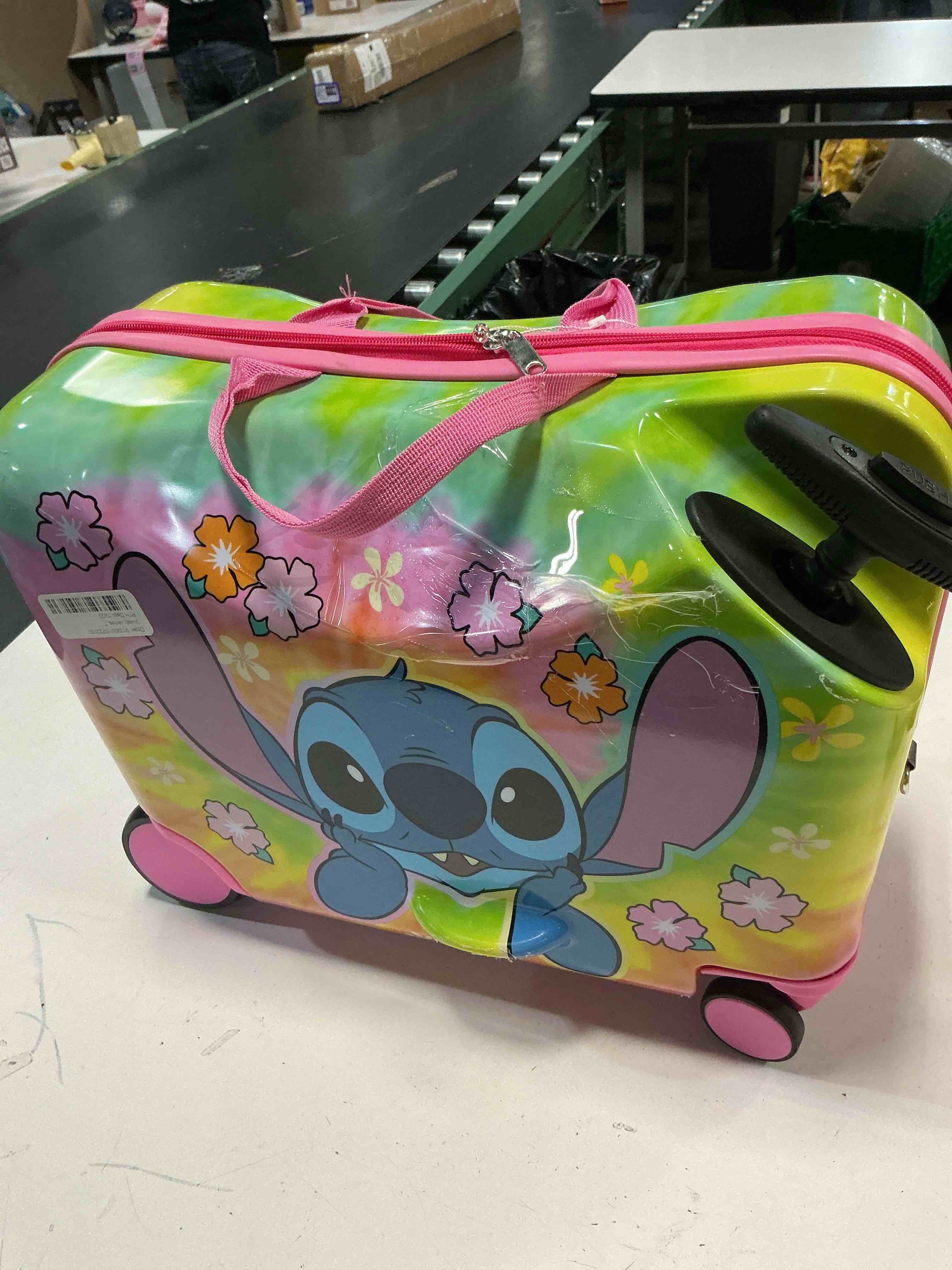 Condition photo showing As Is for disney stitch checked hardside ride on luggage - stitch