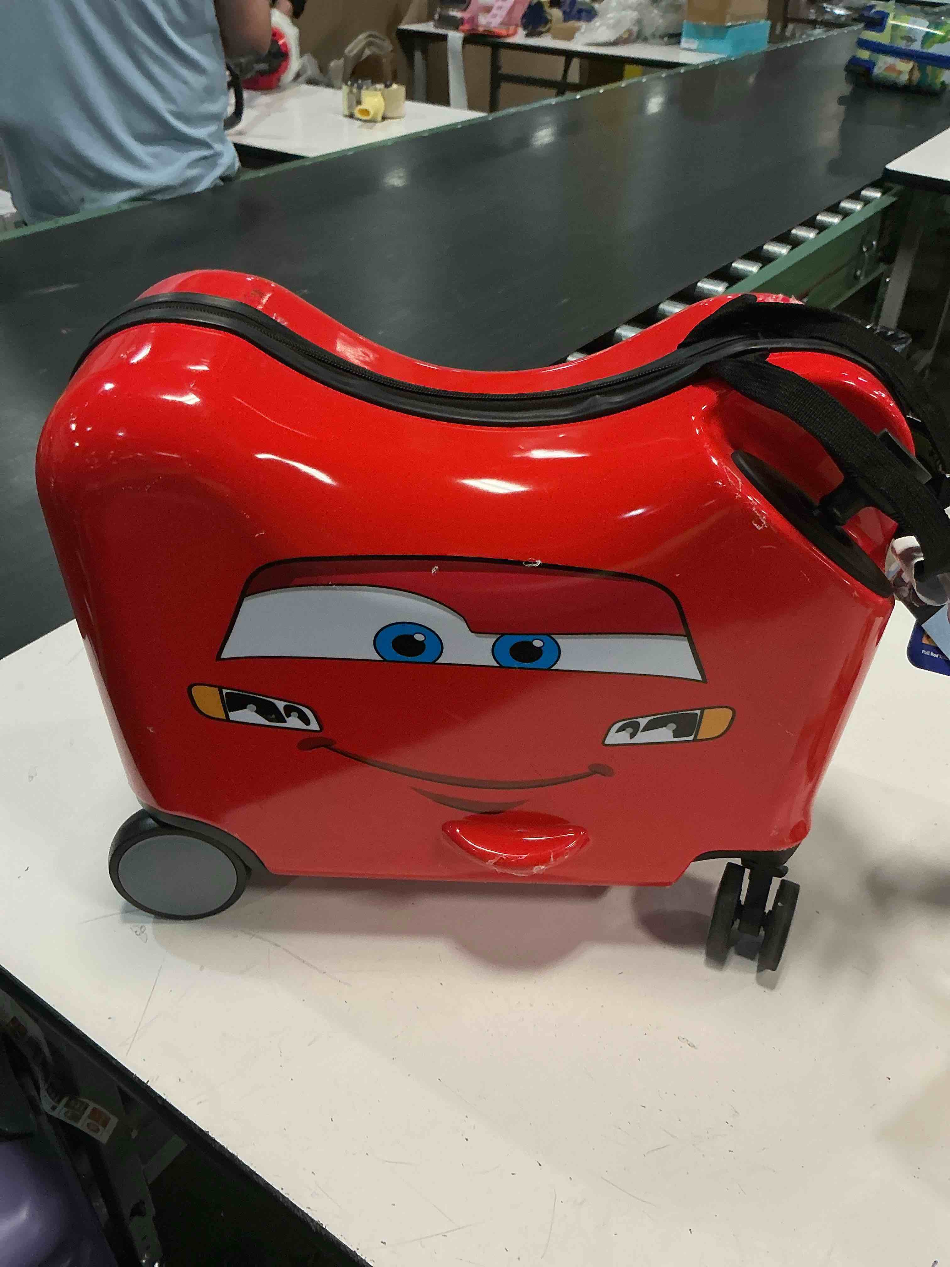 Condition photo showing As Is for disney cars carry on spinner hardside ride on suitcase - red