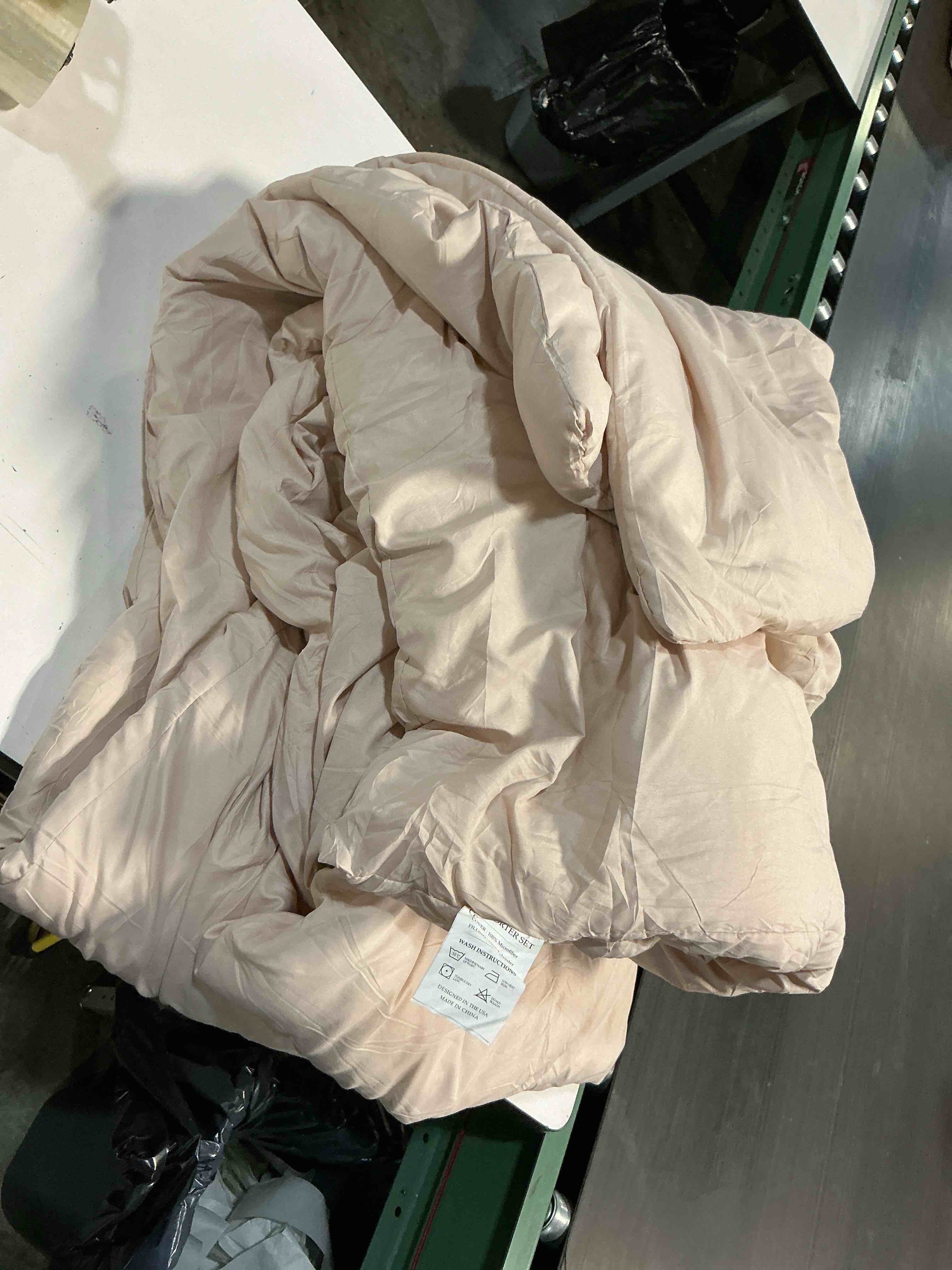 Condition photo showing As Is for comforter, size unknown 