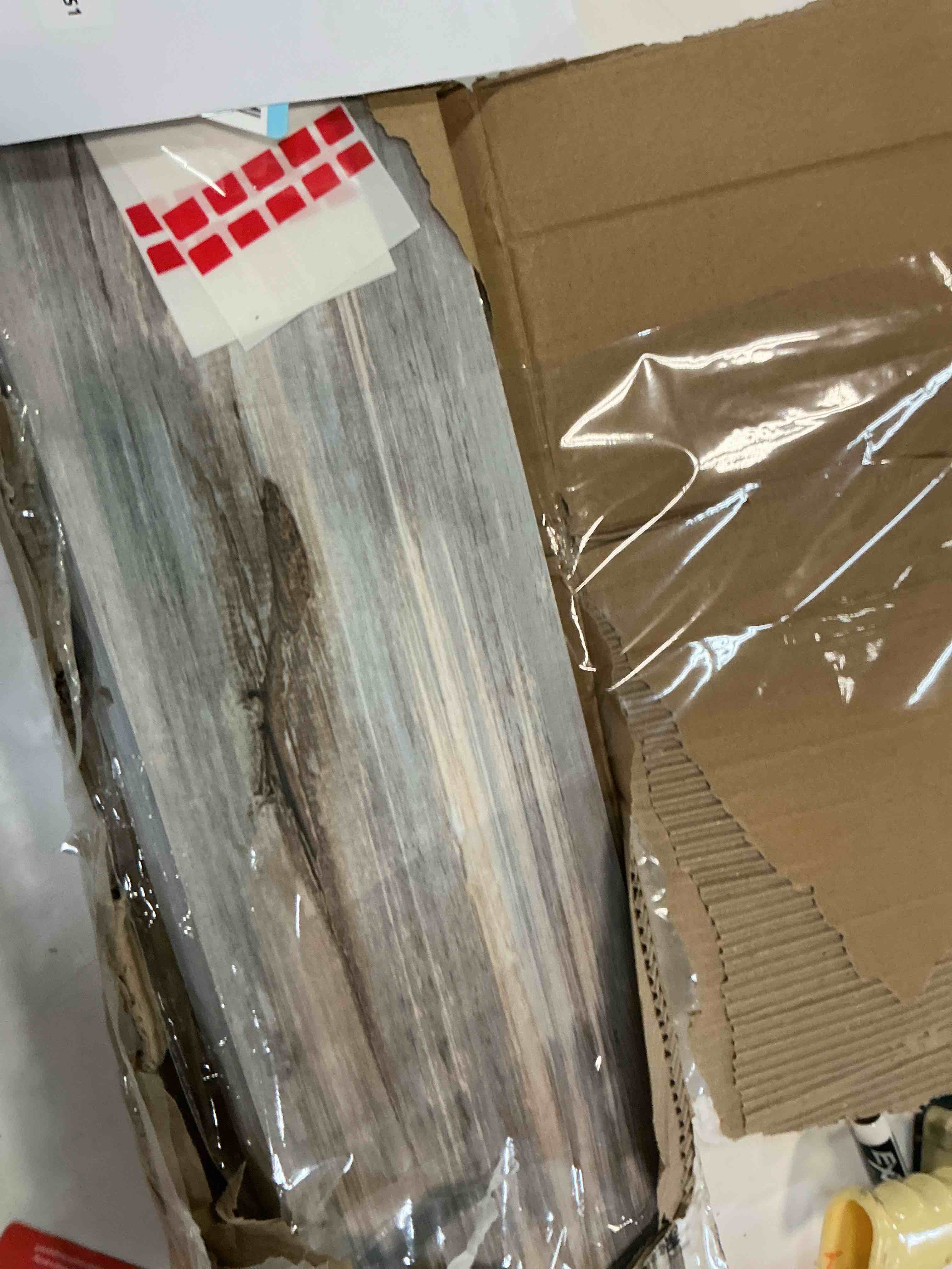 Condition photo showing As Is for wood grain peel and stick floor tiles – 11.8” width, full roll length of 118" – versatile design for any space, grey self adhesive vinyl flooring, waterproof and non-slip features
