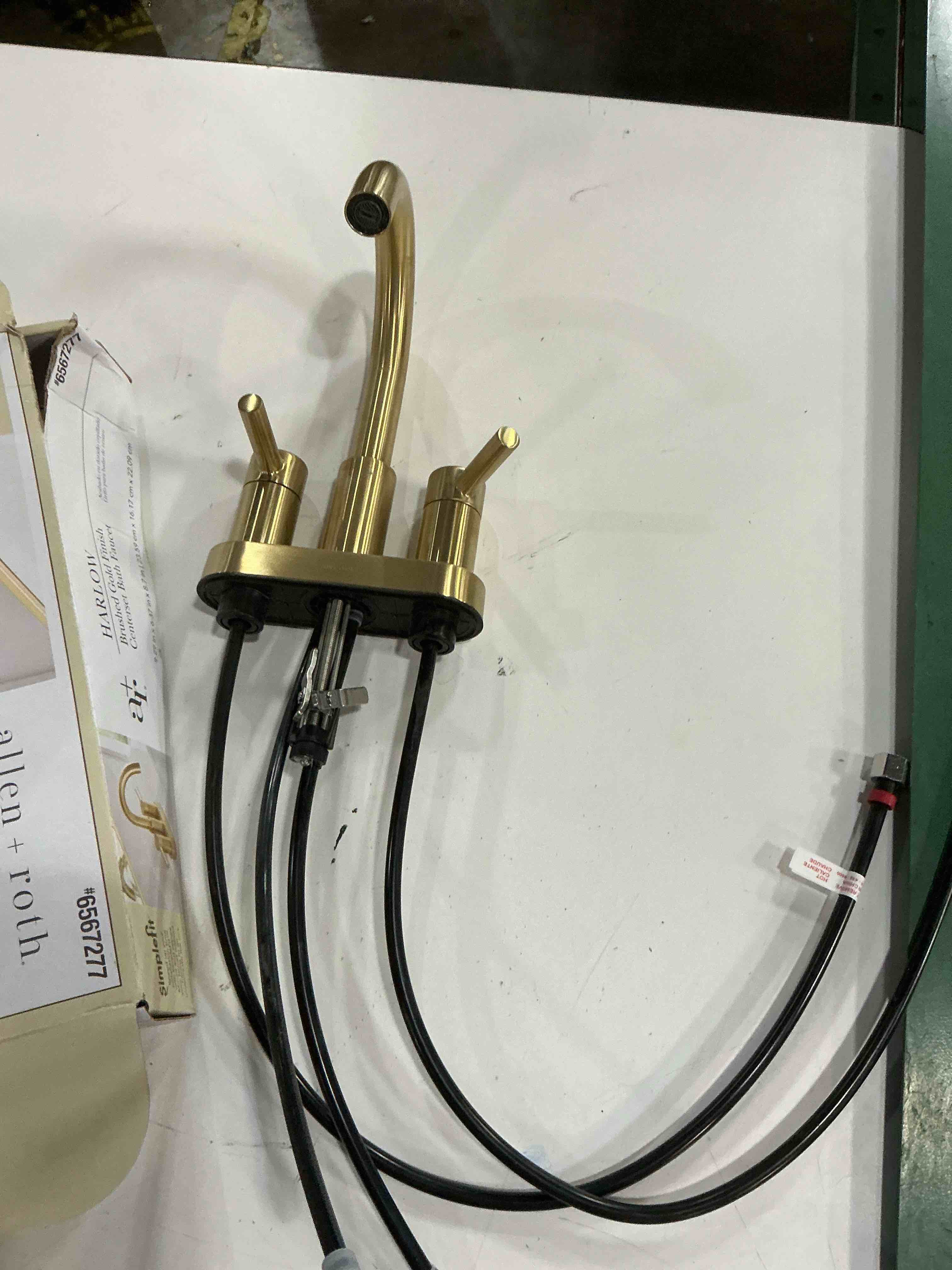 Condition photo showing As Is for bought last week allen + roth harlow simplefit brushed gold 4-in centerset 2-handle watersense mid-arc